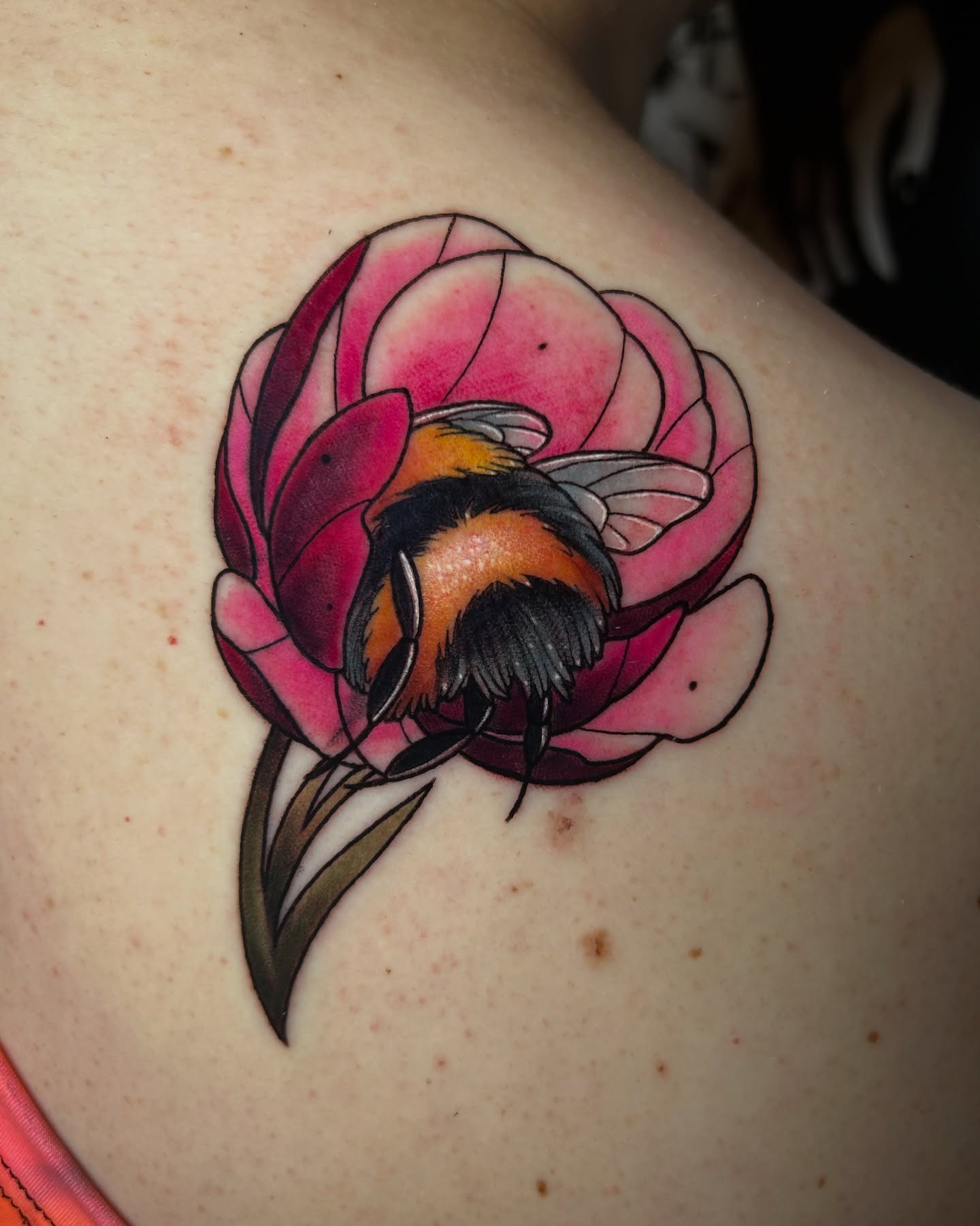Bee and flower realism tattoo on the shoulder by Tattoos By Lola Cavotta, Willoughby, Ohio