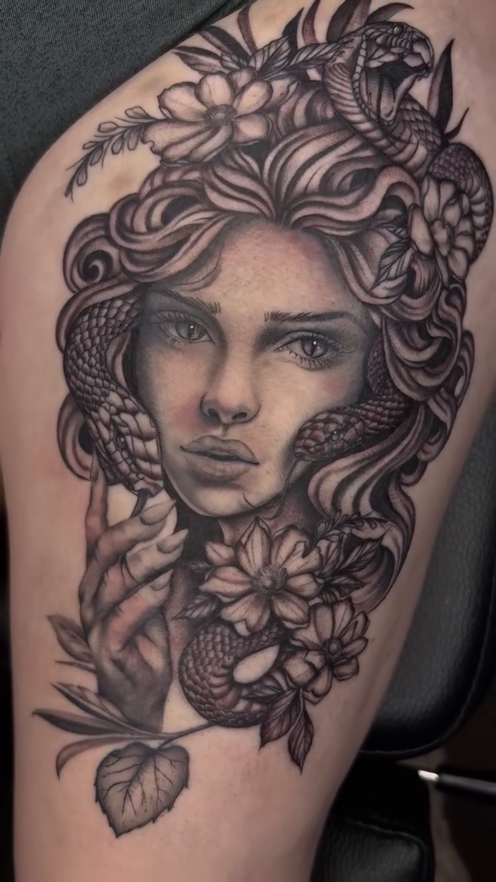 Tattoo by @taboo.tattoos_ — realism, black_and_grey