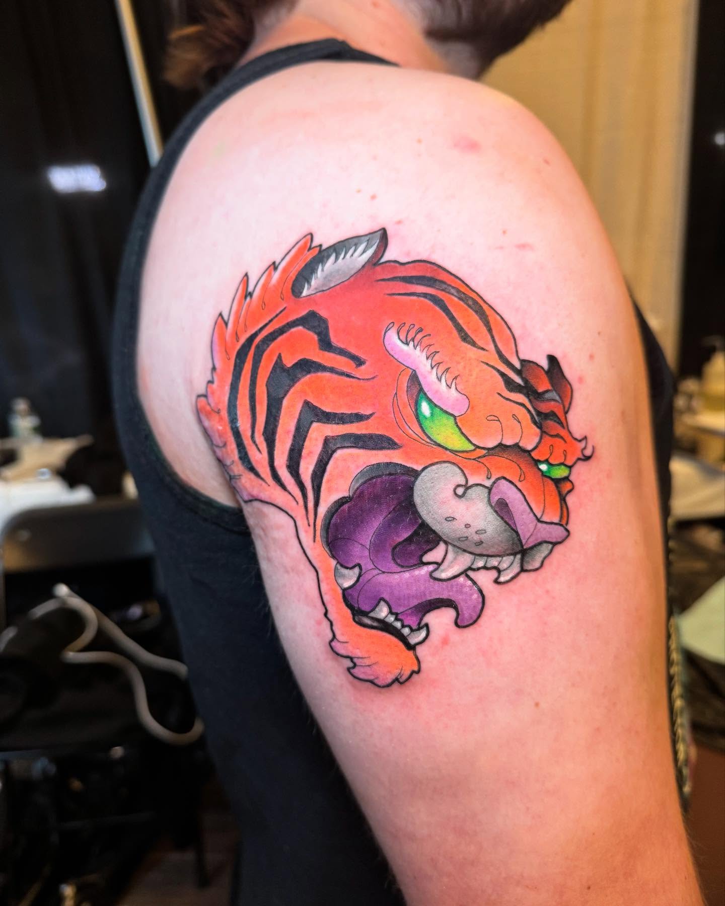 Tiger new school tattoo on the shoulder by Nathan Evans