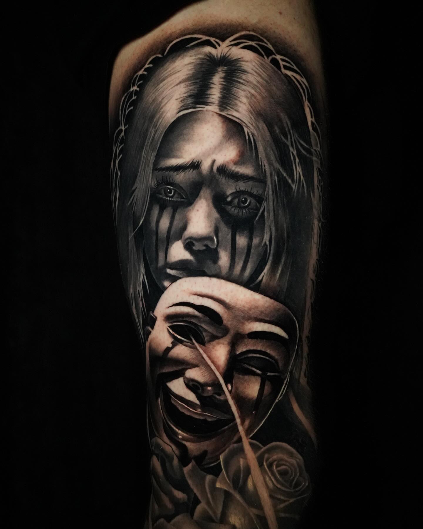 Woman crying with mask realism tattoo on the forearm by Miles Johnson