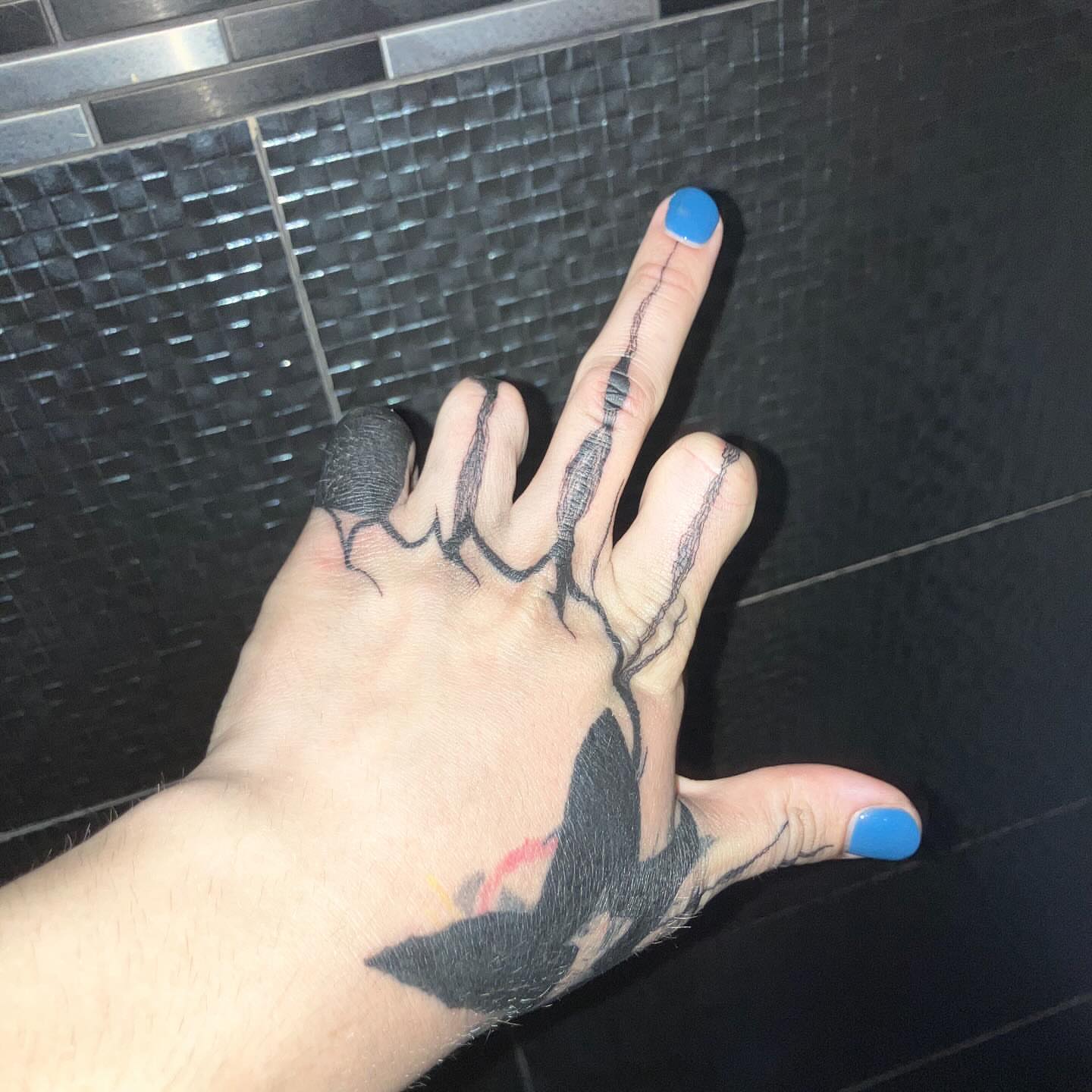 Abstract design black and grey tattoo on the hand by @godsfirmgrip