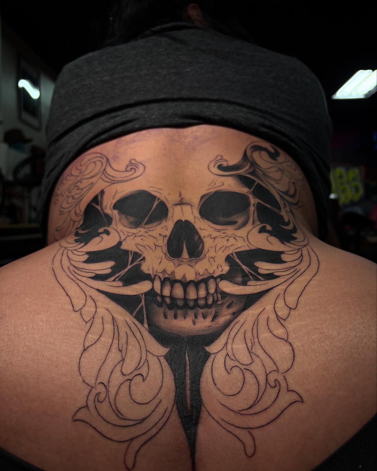 Skull realism tattoo on the back by Alexandria
