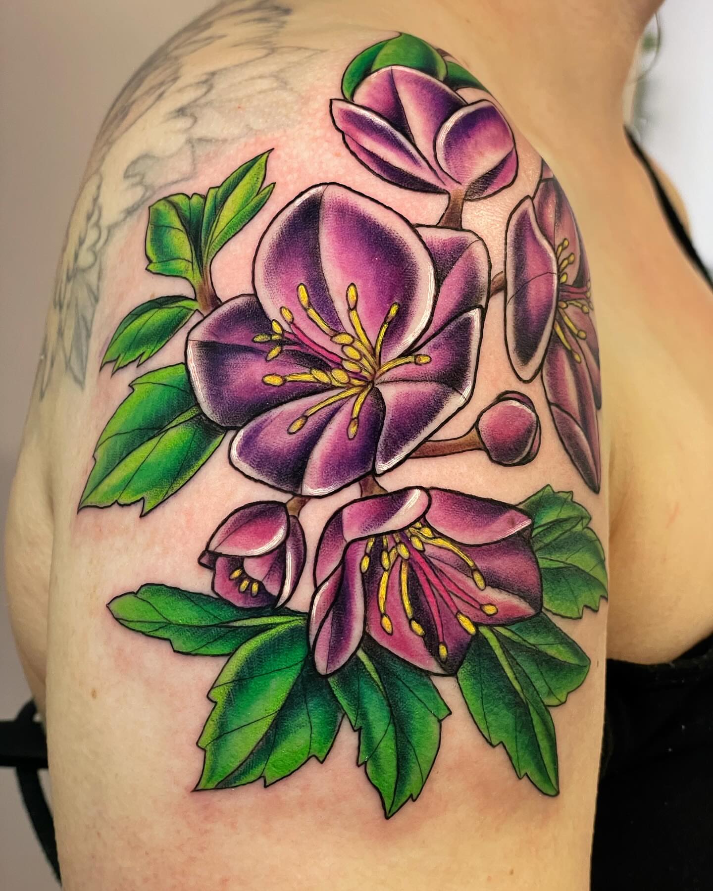 Purple flowers realism tattoo on the shoulder by Michelle Pomerantz 🌼 Portland Tattoo Artist