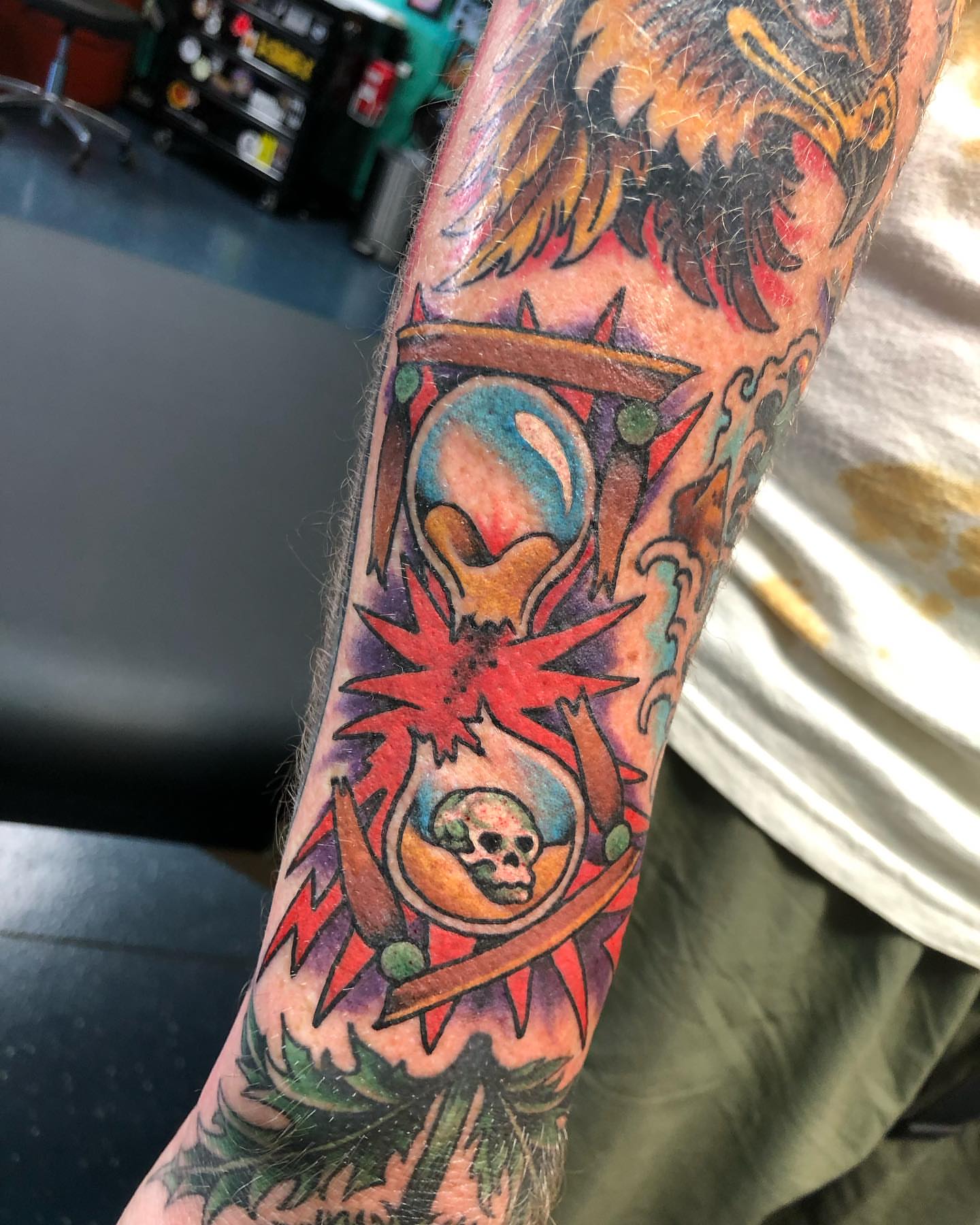 Skull and flame American traditional tattoo on the forearm by Matt Klass