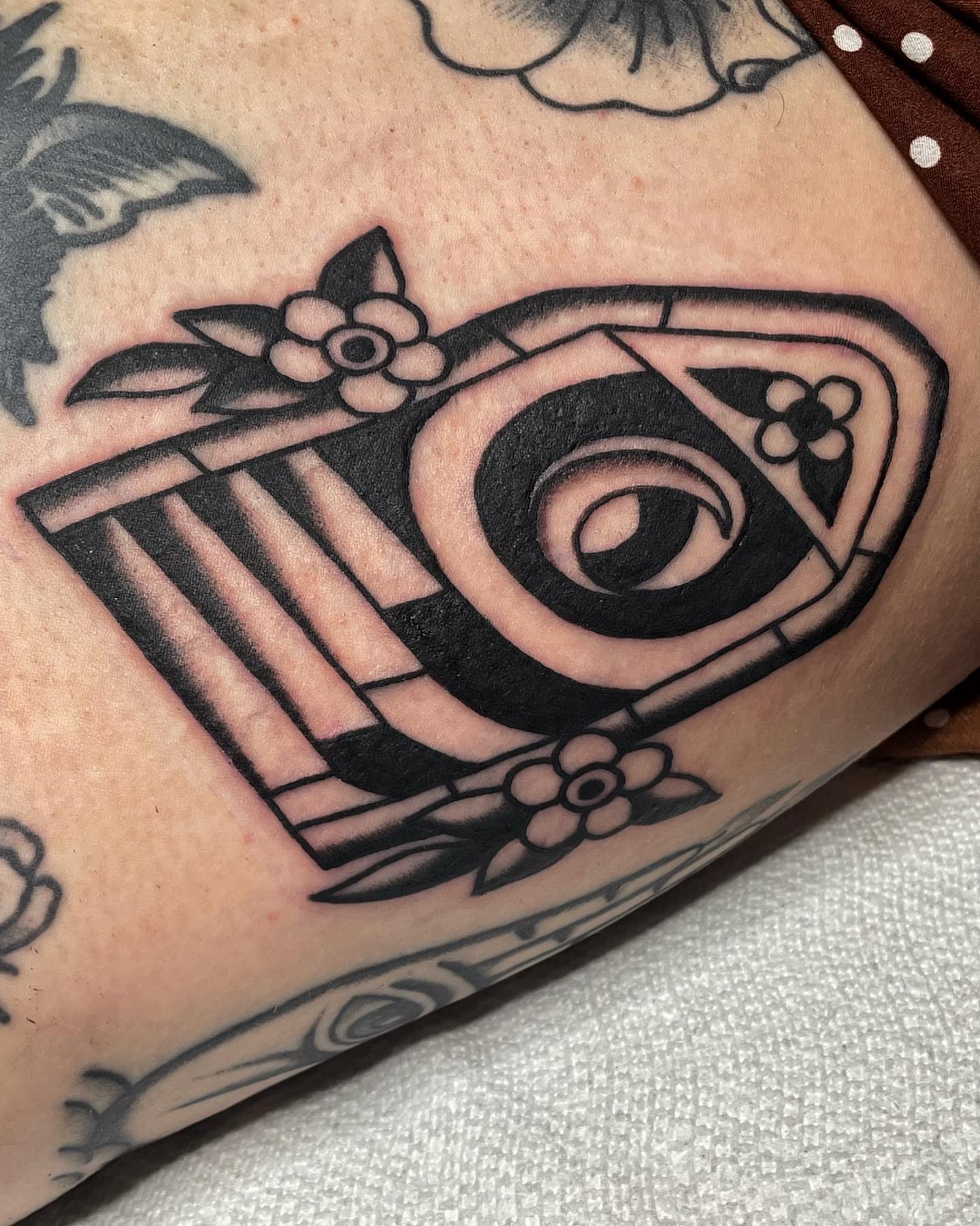 Eye and flowers American traditional tattoo on the forearm by nancy❣️