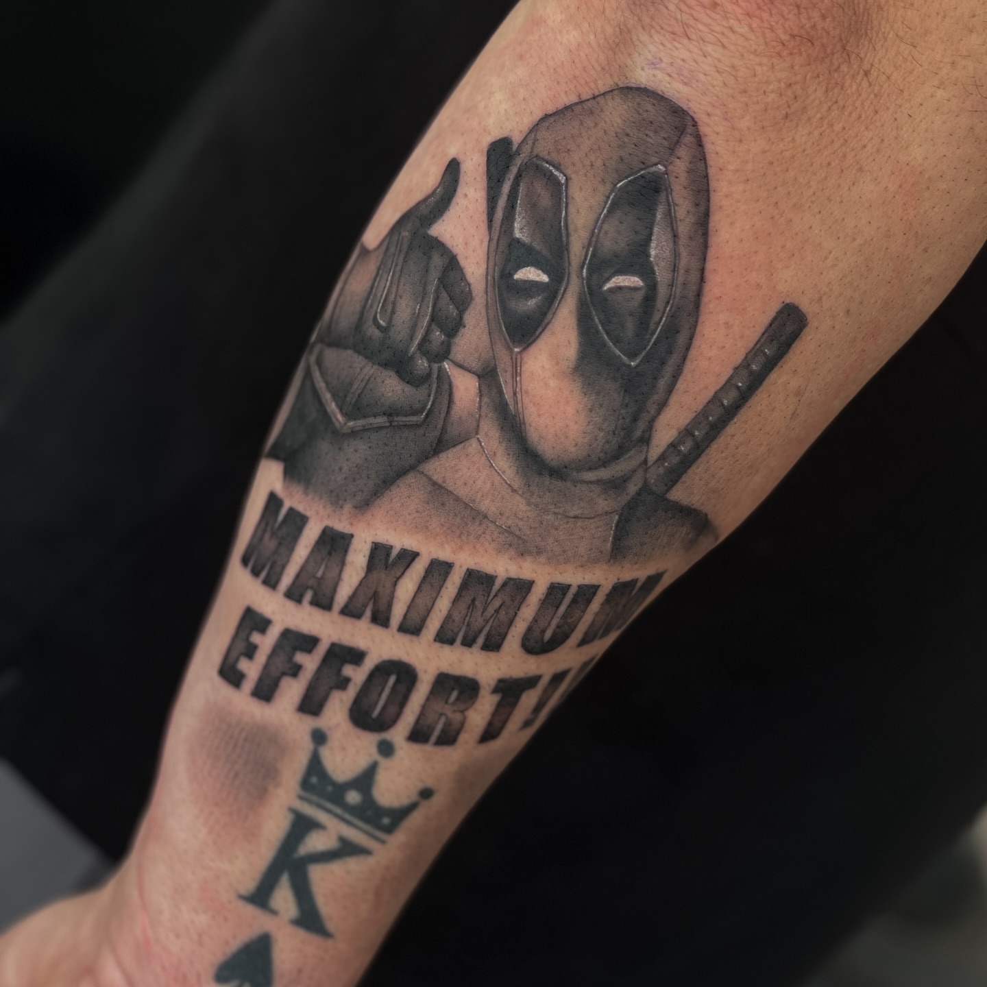 Deadpool black and grey tattoo on the forearm by Erica Olivier