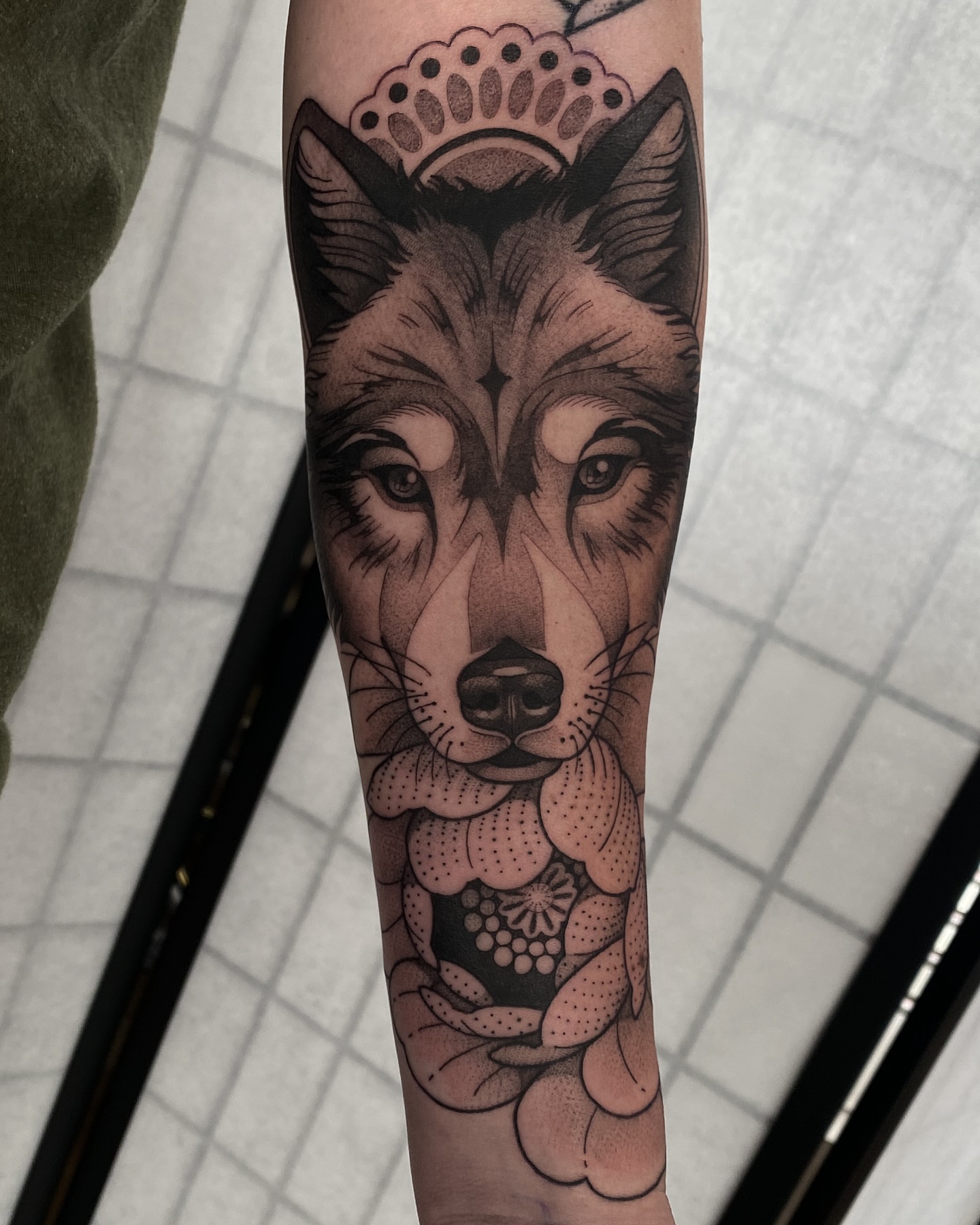 Wolf dotwork tattoo on the forearm by Natasha Dickinson