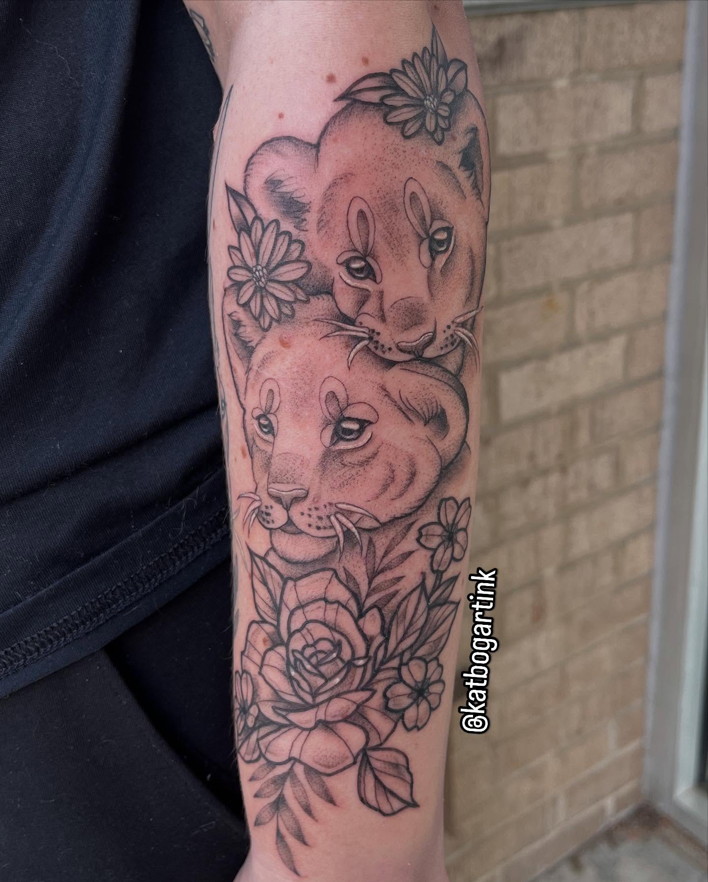 Lionesses and flowers realism tattoo on the forearm by Kat (Scout) Bogart