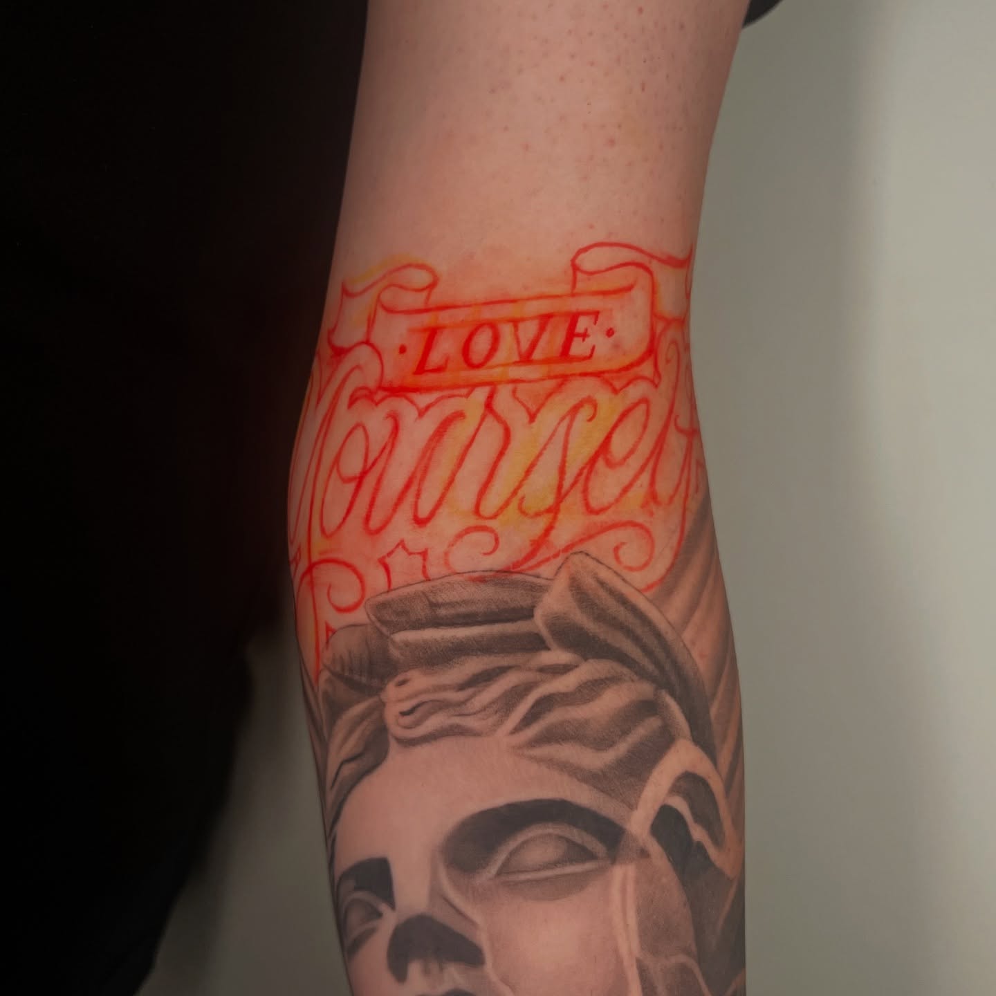 Statue head realism tattoo on the forearm by Geo