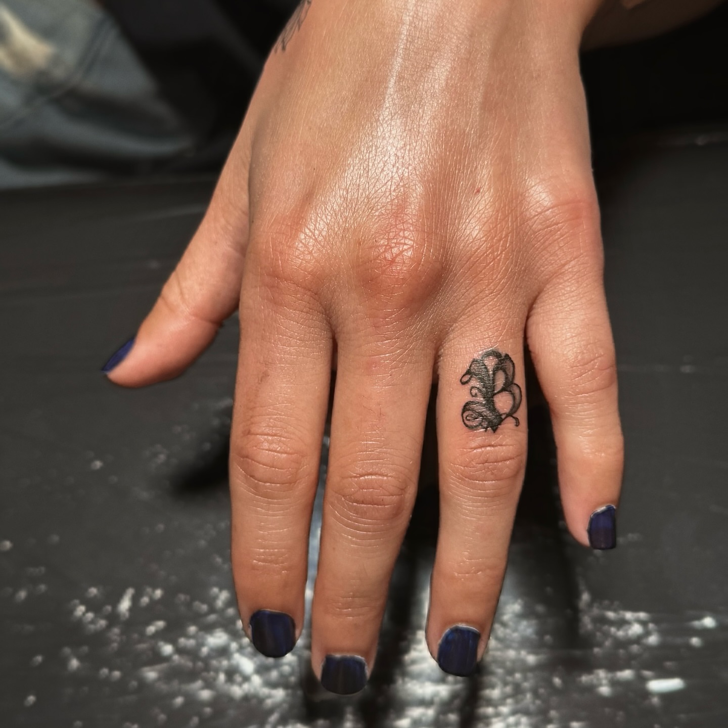 Swirl black and grey tattoo on the hand by Jewels, St. George, Utah