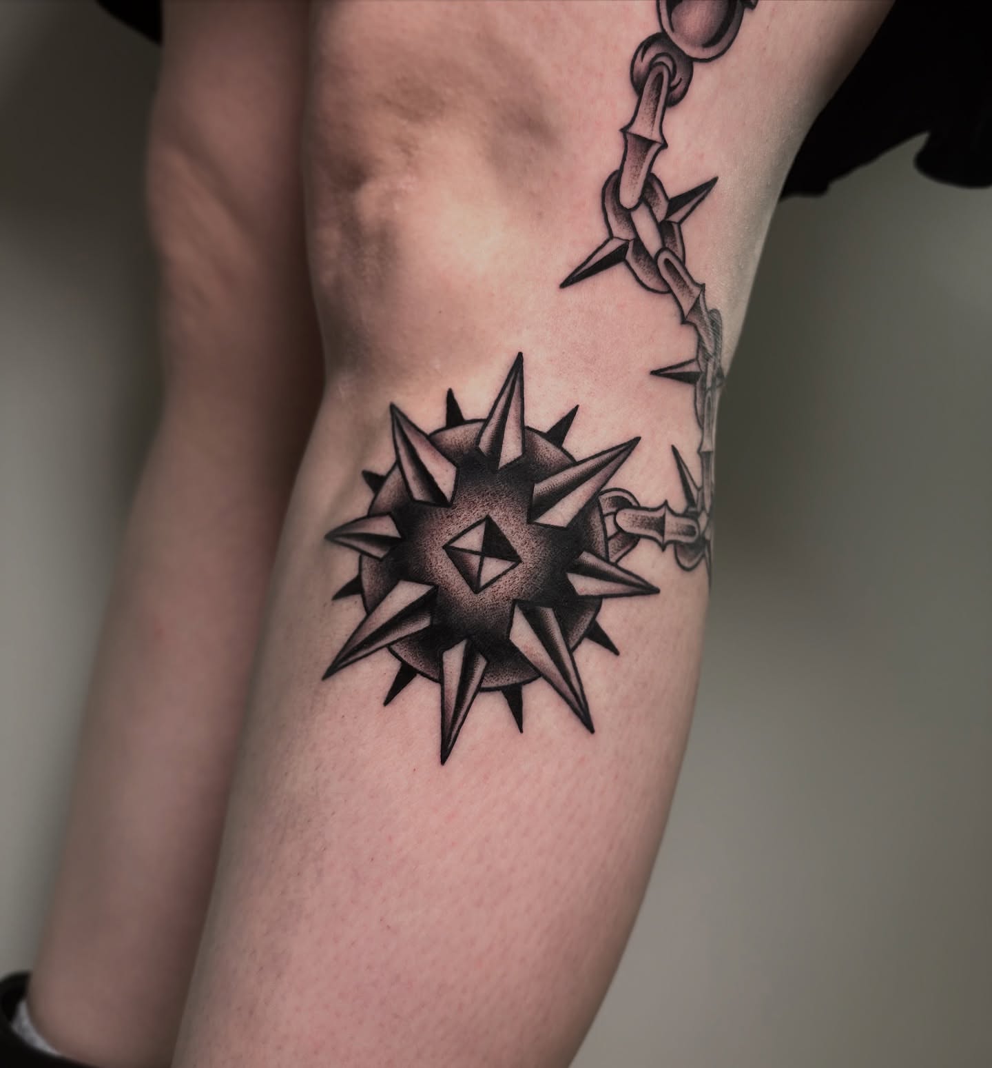 Spiked compass geometric tattoo on the forearm by Patrick Whiting