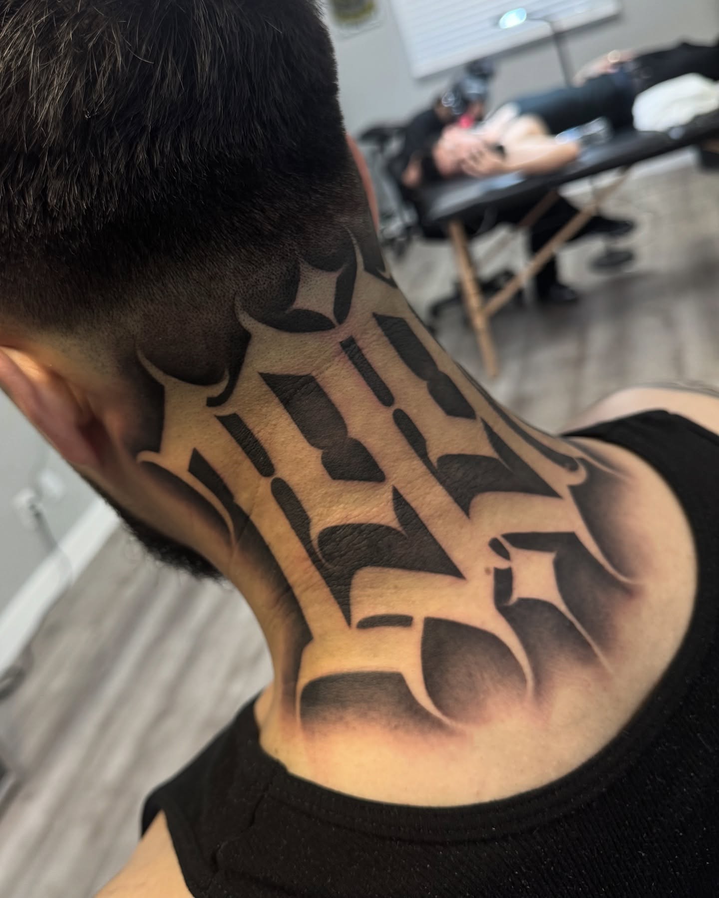Lettering lettering script tattoo on the neck by Letterrealmstudio