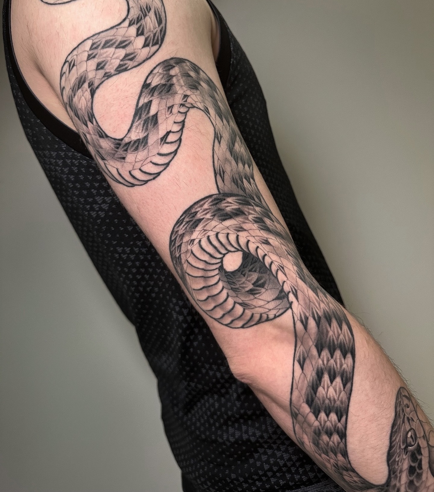 Snake realism tattoo on the forearm by Patrick Whiting