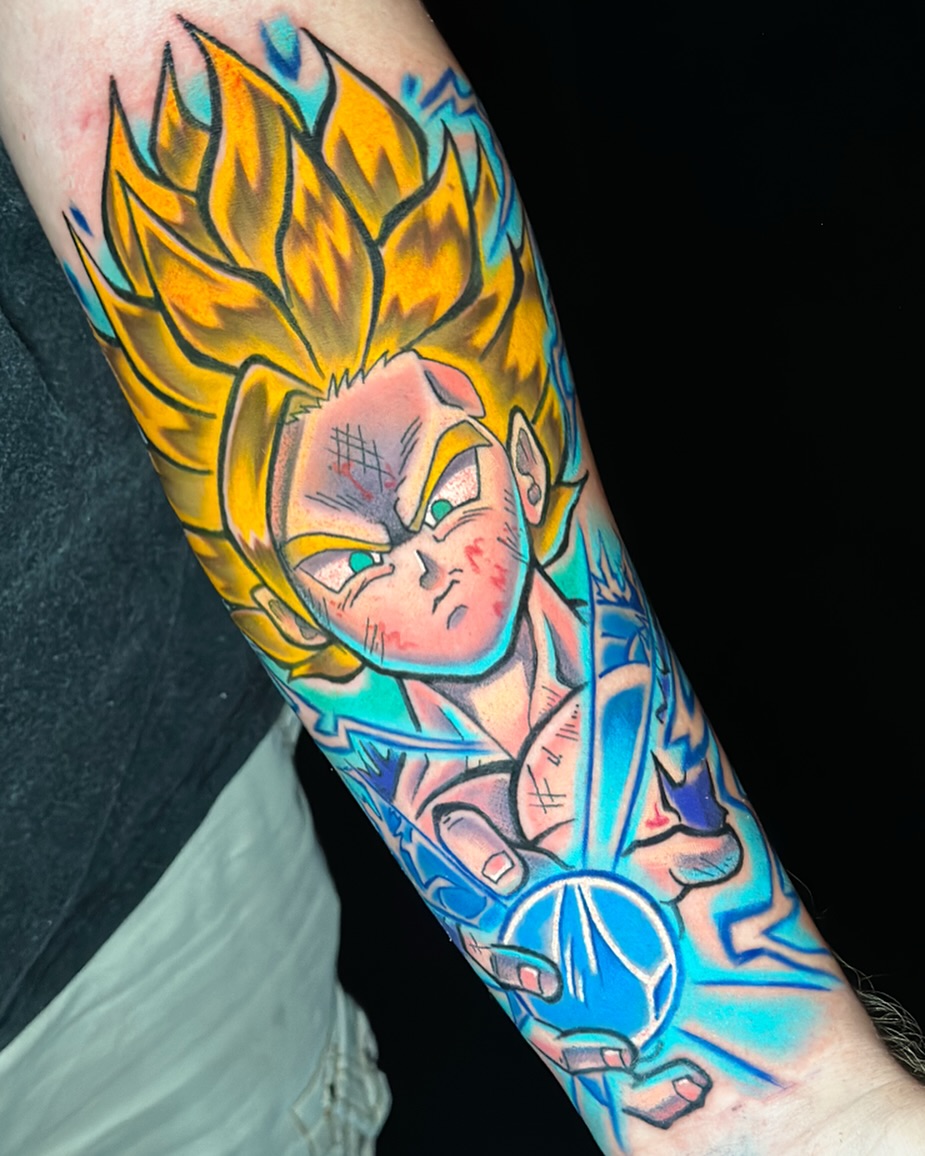 Super saiyan anime tattoo on the forearm by Jeremy Thomas