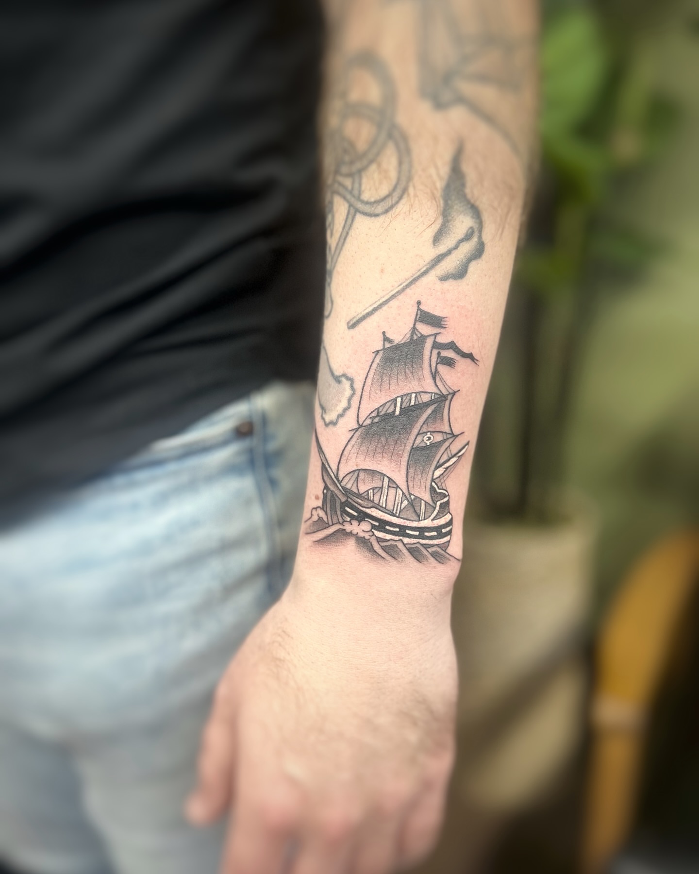 Ship black and grey tattoo on the forearm by sam cedar geller 🐝