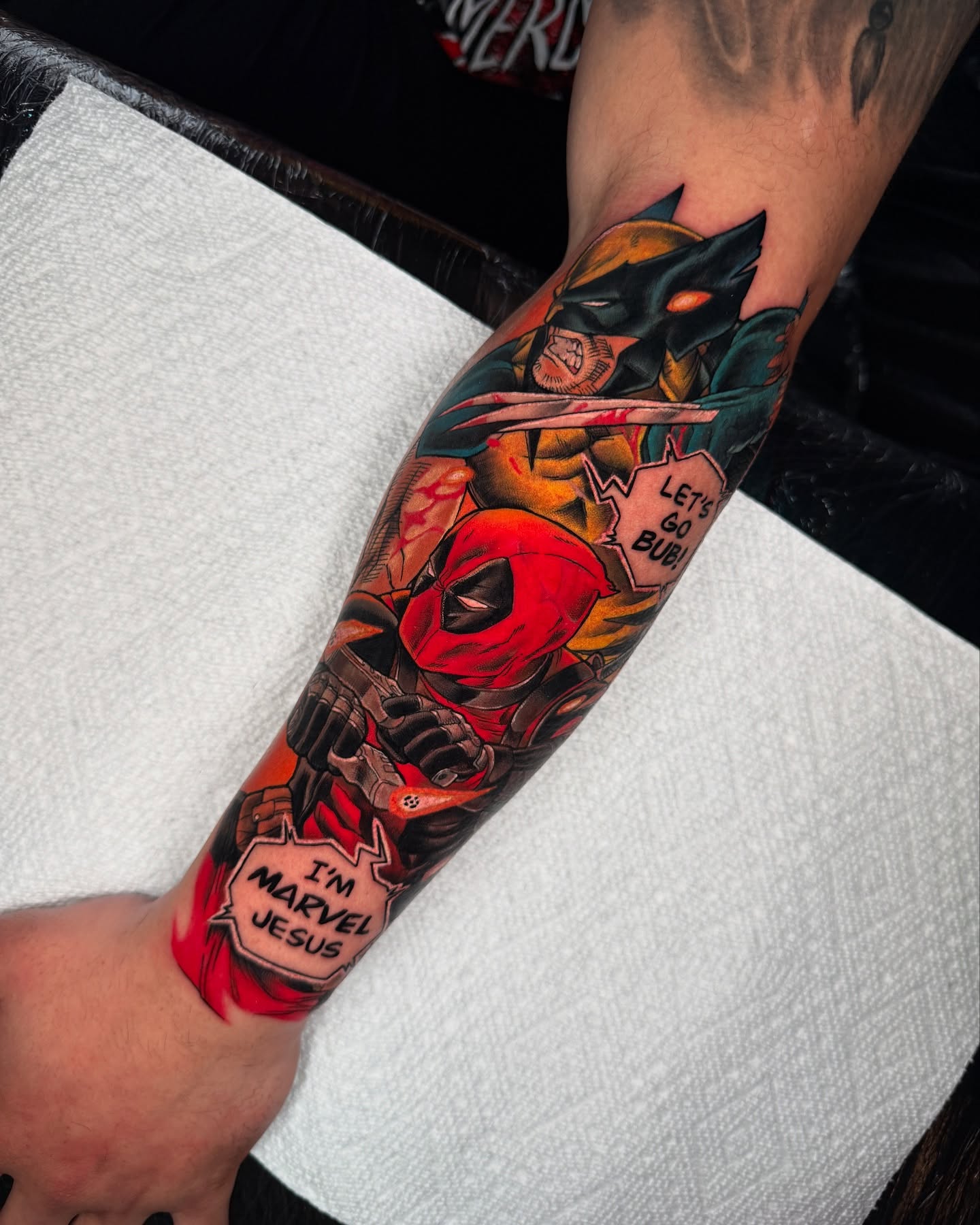 Deadpool and Batman American traditional tattoo on the forearm by Rigo4k