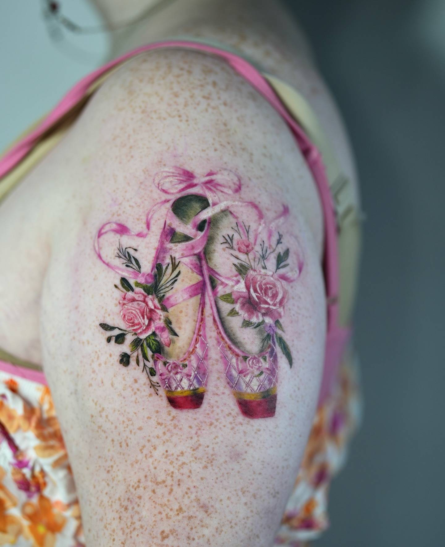 Ballerina shoes and roses realism tattoo on the shoulder by Henry
