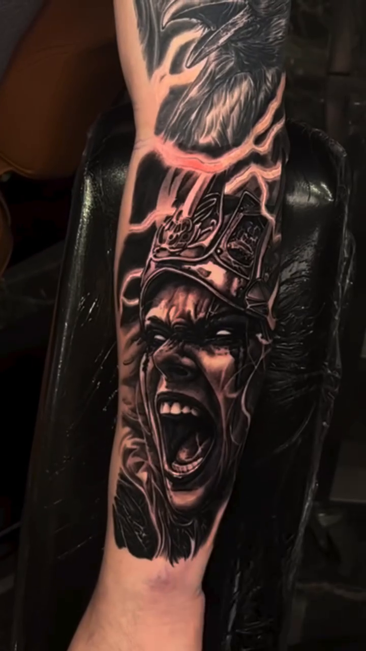 Man with beard and screaming face dark realism tattoo by Jake Ross, Mentor, Ohio