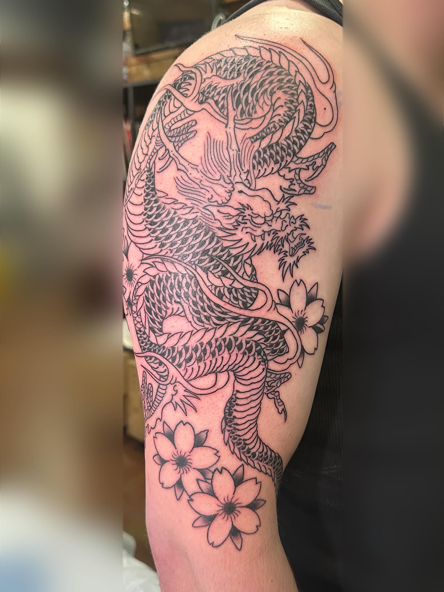 Dragon and cherry blossoms japanese irezumi tattoo on the shoulder by Wesley Lam