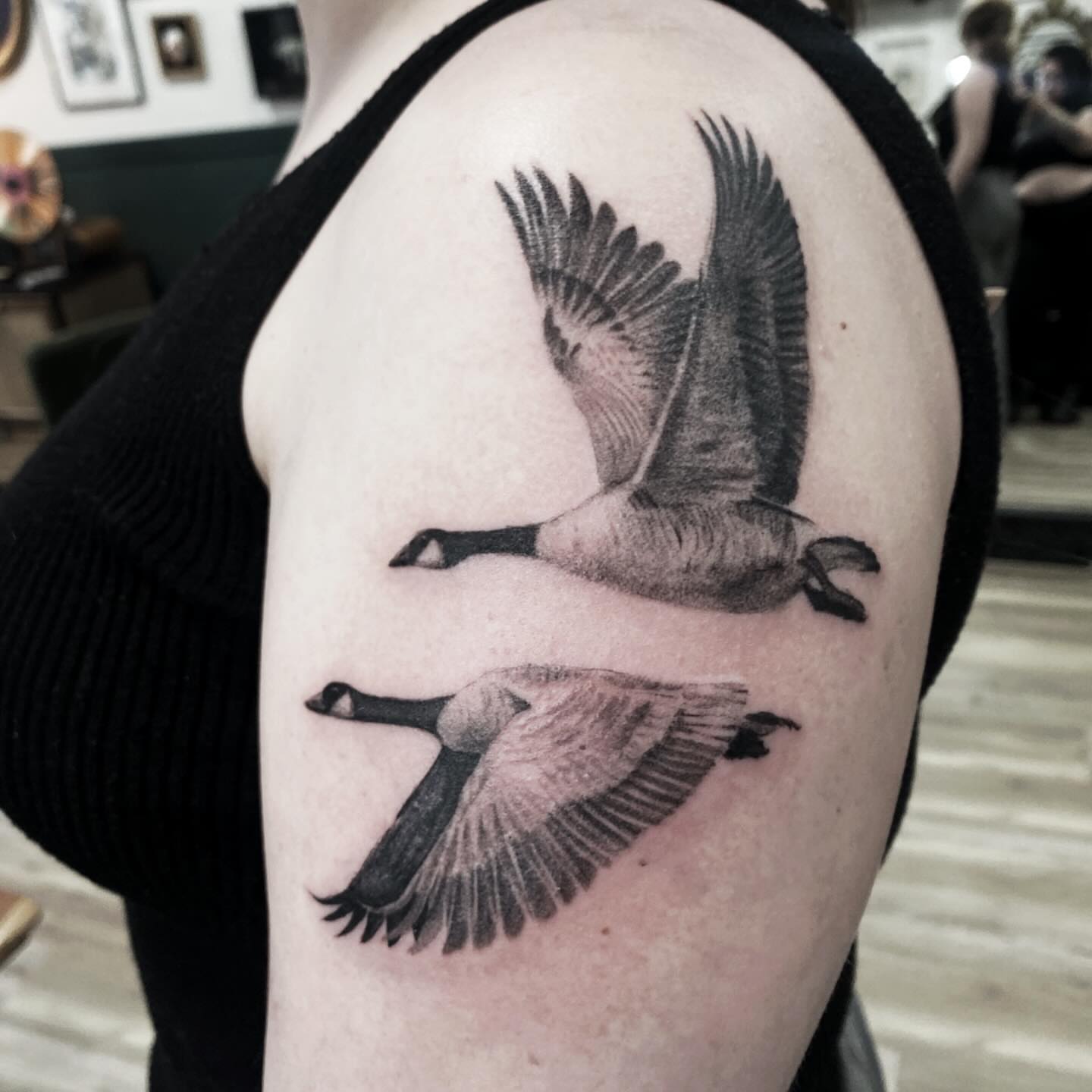 Geese in flight realism tattoo on the shoulder by Jazz