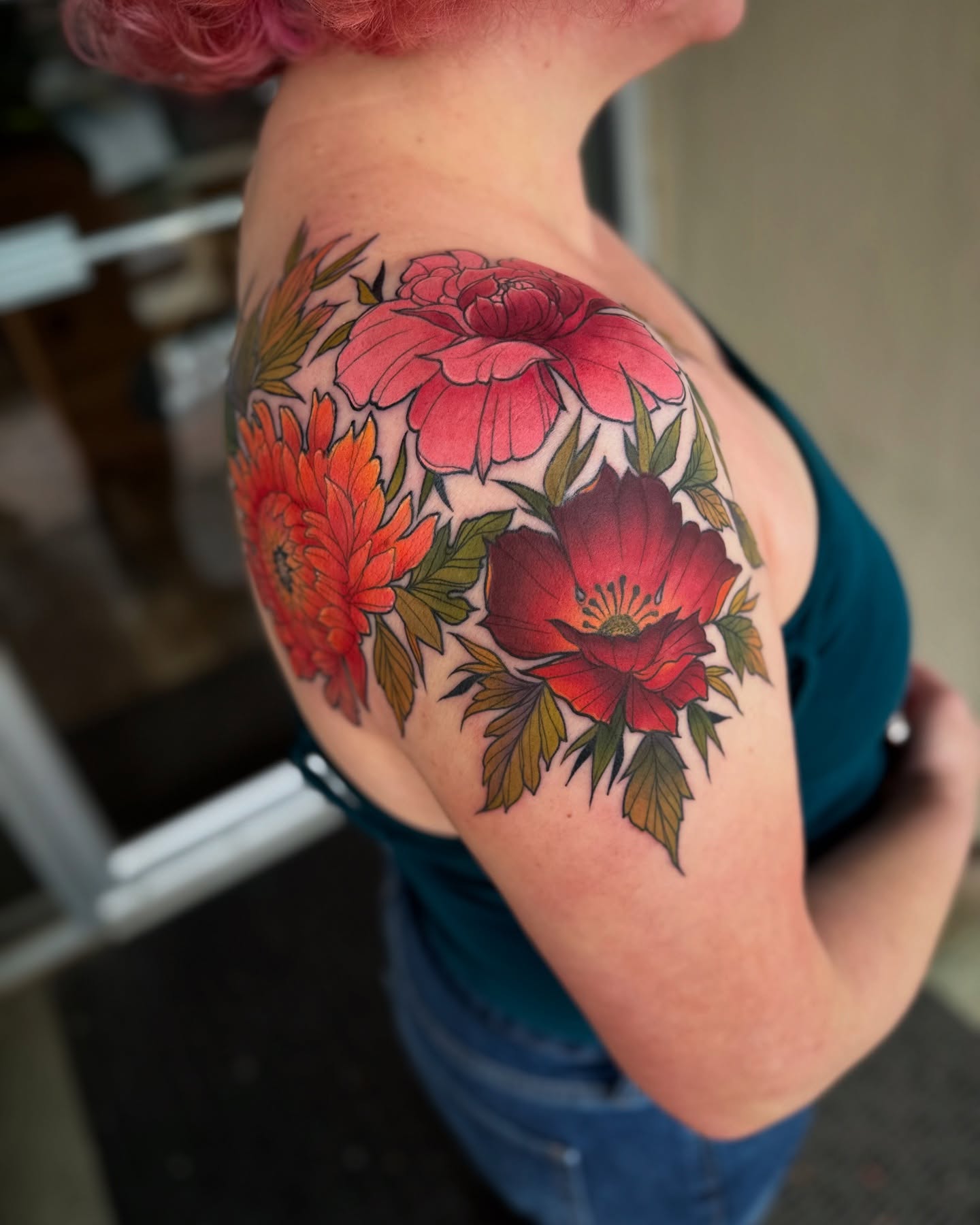 Floral bouquet new school tattoo on the shoulder by Michael Langdale