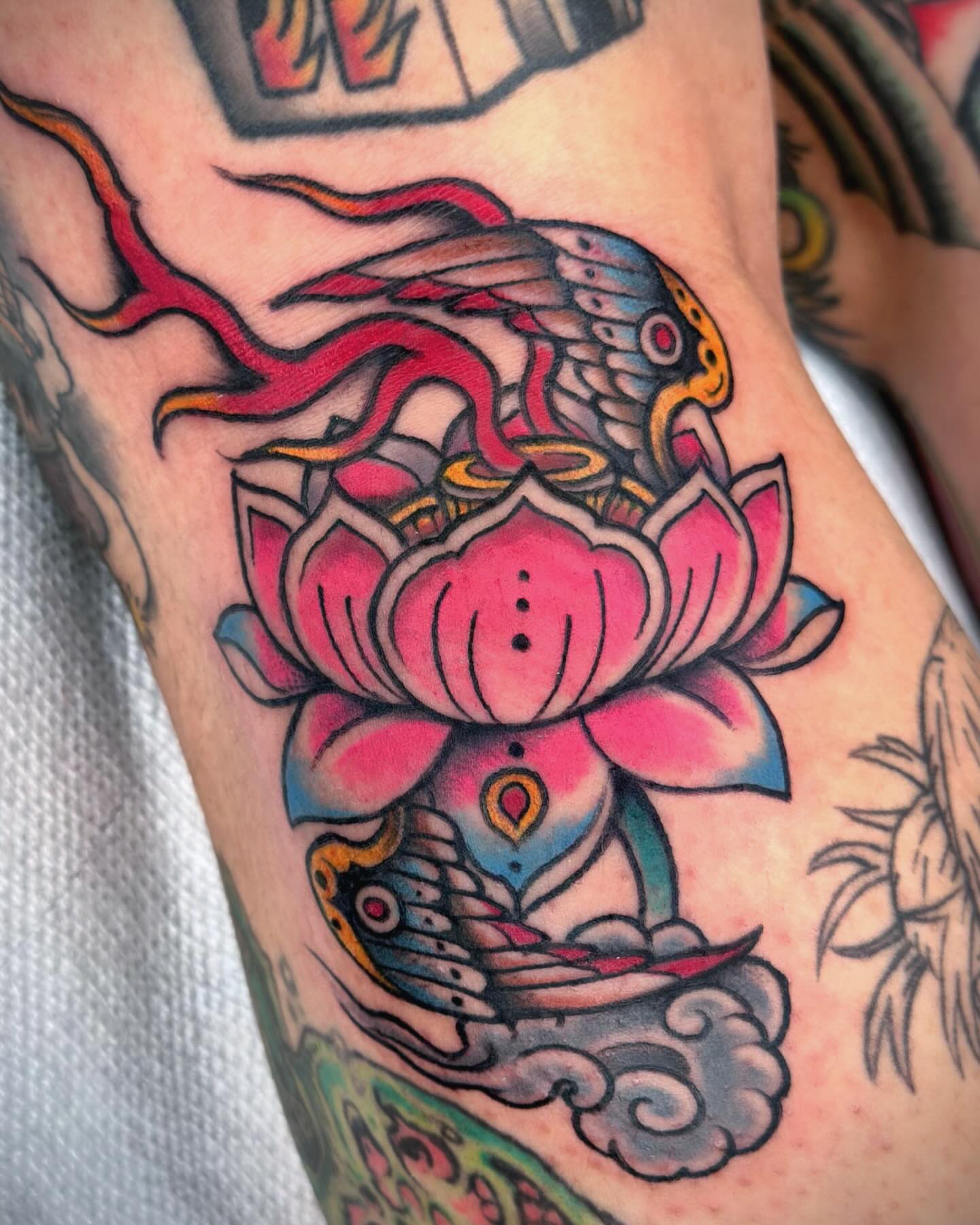 Lotus flower and phoenix American traditional tattoo on the forearm by “𝙺𝚊𝚒𝚗 𝚅𝚎𝚕𝚊𝚜𝚌𝚘”, Austin, Texas