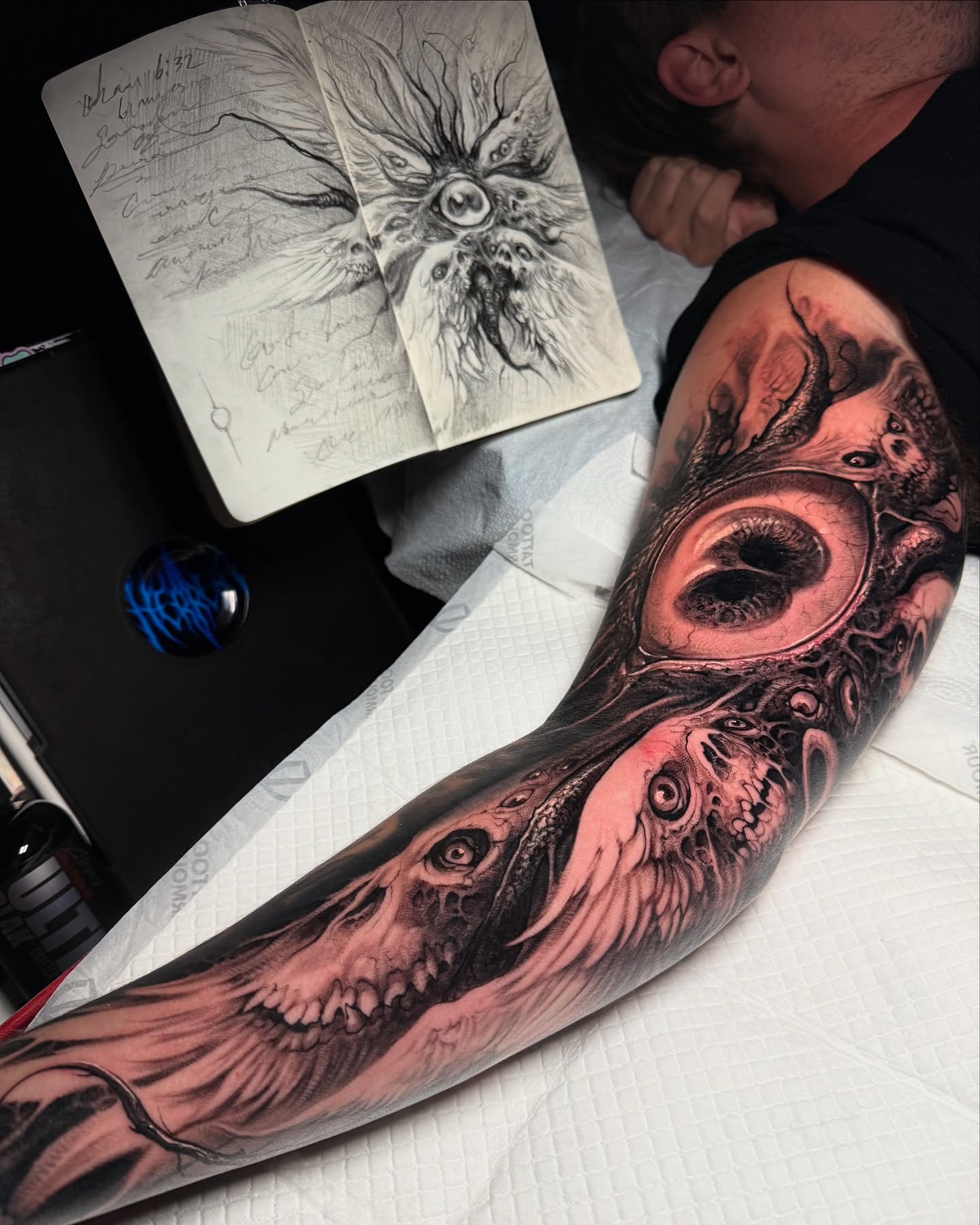 Eye and skull realism tattoo on the forearm by Brandon Herrera