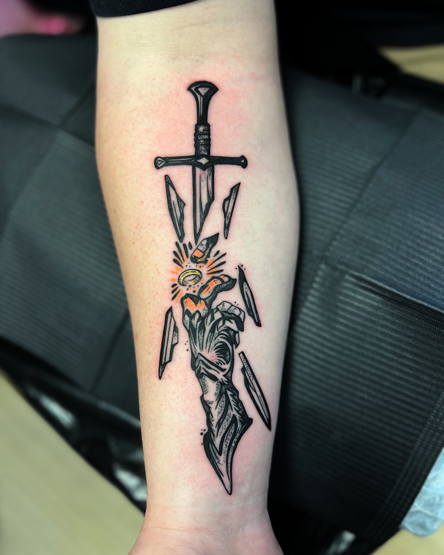 Sword and flower black and grey tattoo on the forearm by Hugh Anthony Washington, Hattiesburg, Mississippi