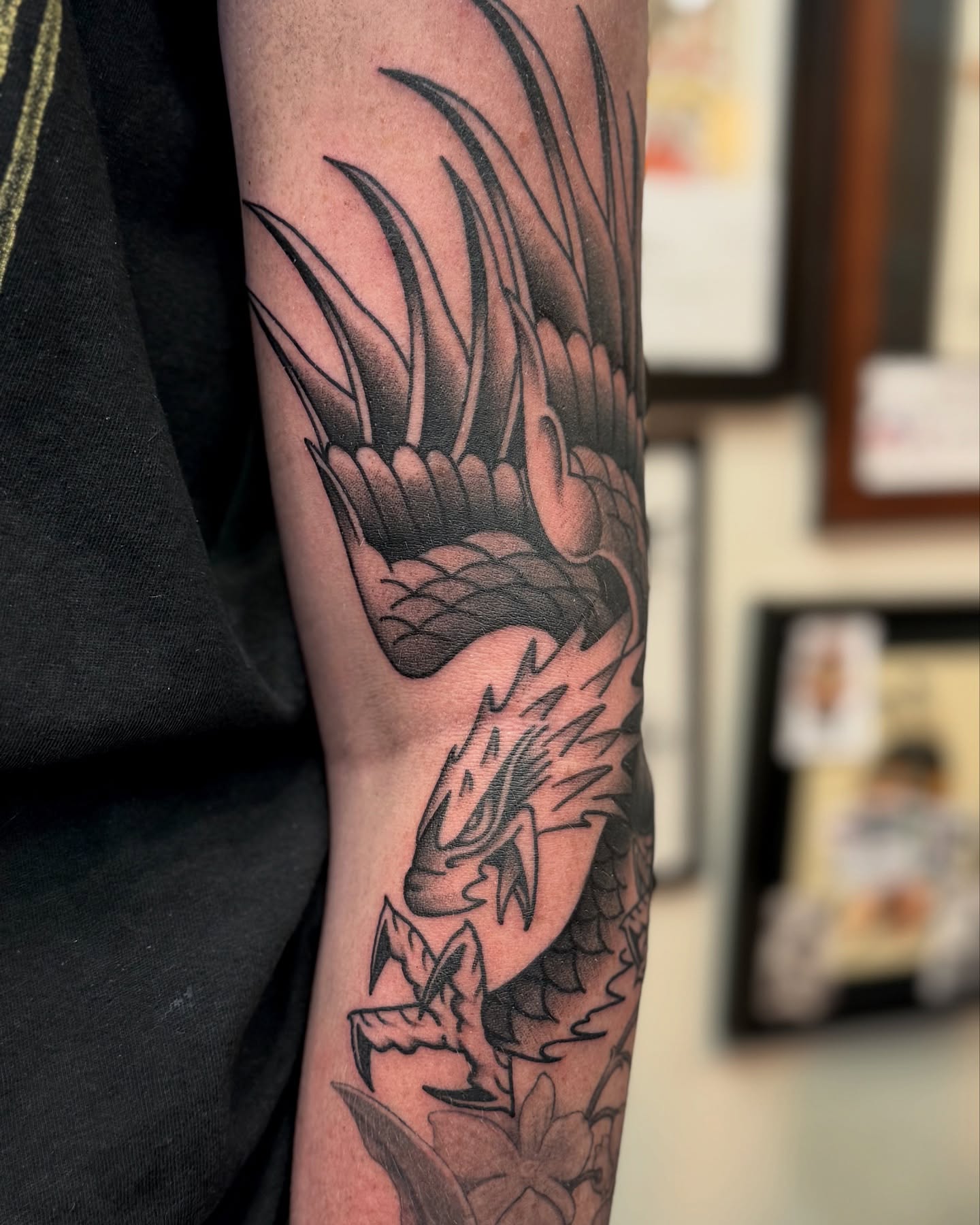 Dragon American traditional tattoo on the forearm by Ernie Rivera