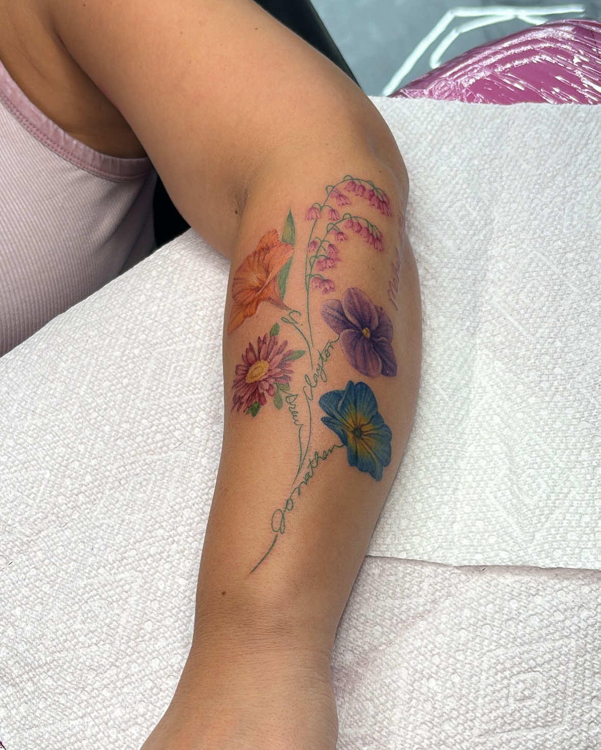 Floral arrangement new school tattoo on the forearm by Júlia Sorrino