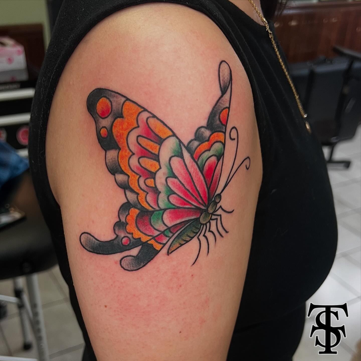 Butterfly American traditional tattoo on the shoulder by Keith Underwood