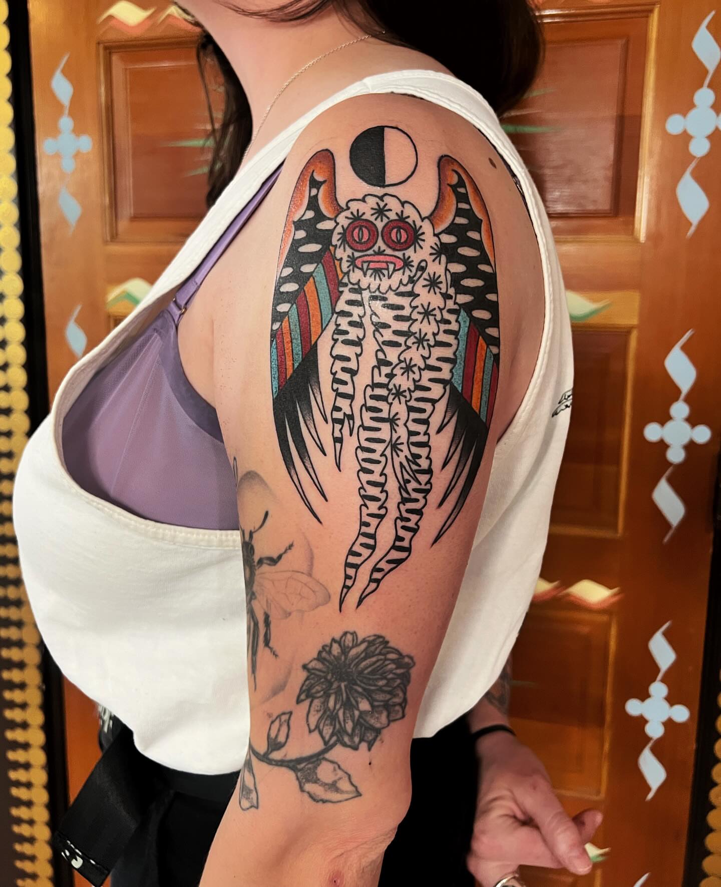 Owl American traditional tattoo on the upper arm by Manee Friday