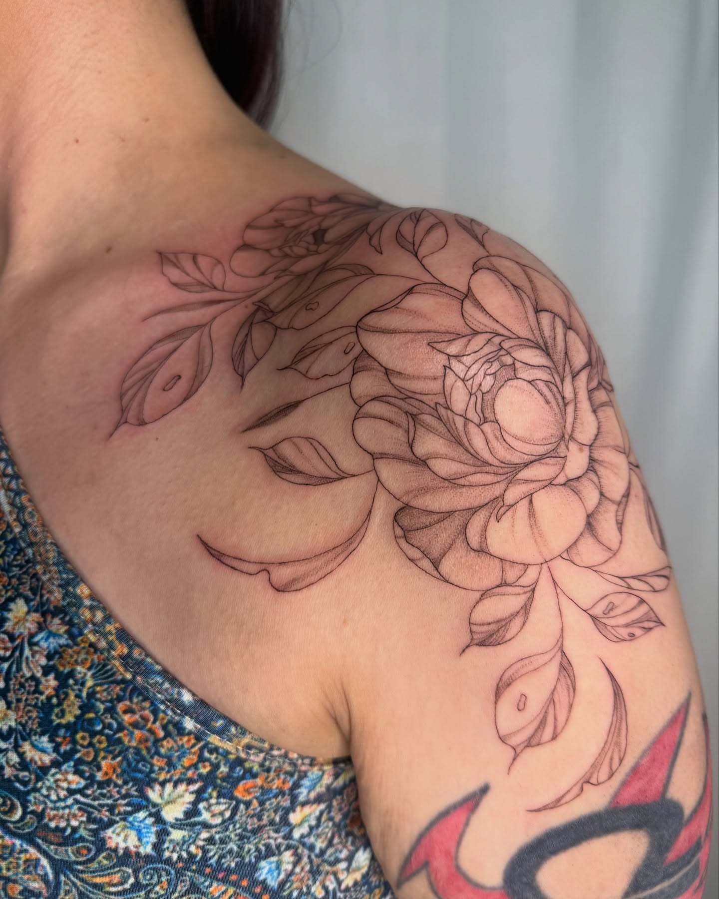 Floral bouquet black and grey tattoo on the shoulder by elena