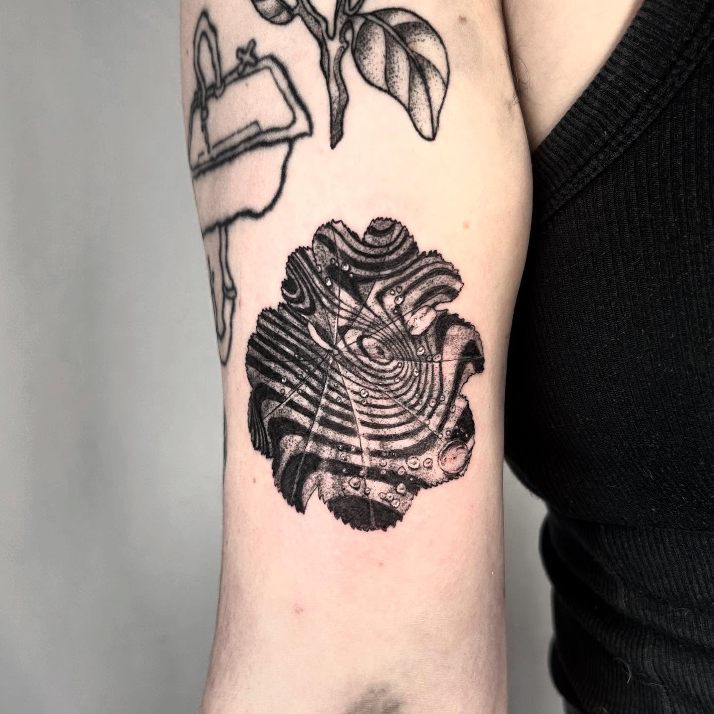 Abstract pattern dotwork tattoo on the forearm by Nikki Power