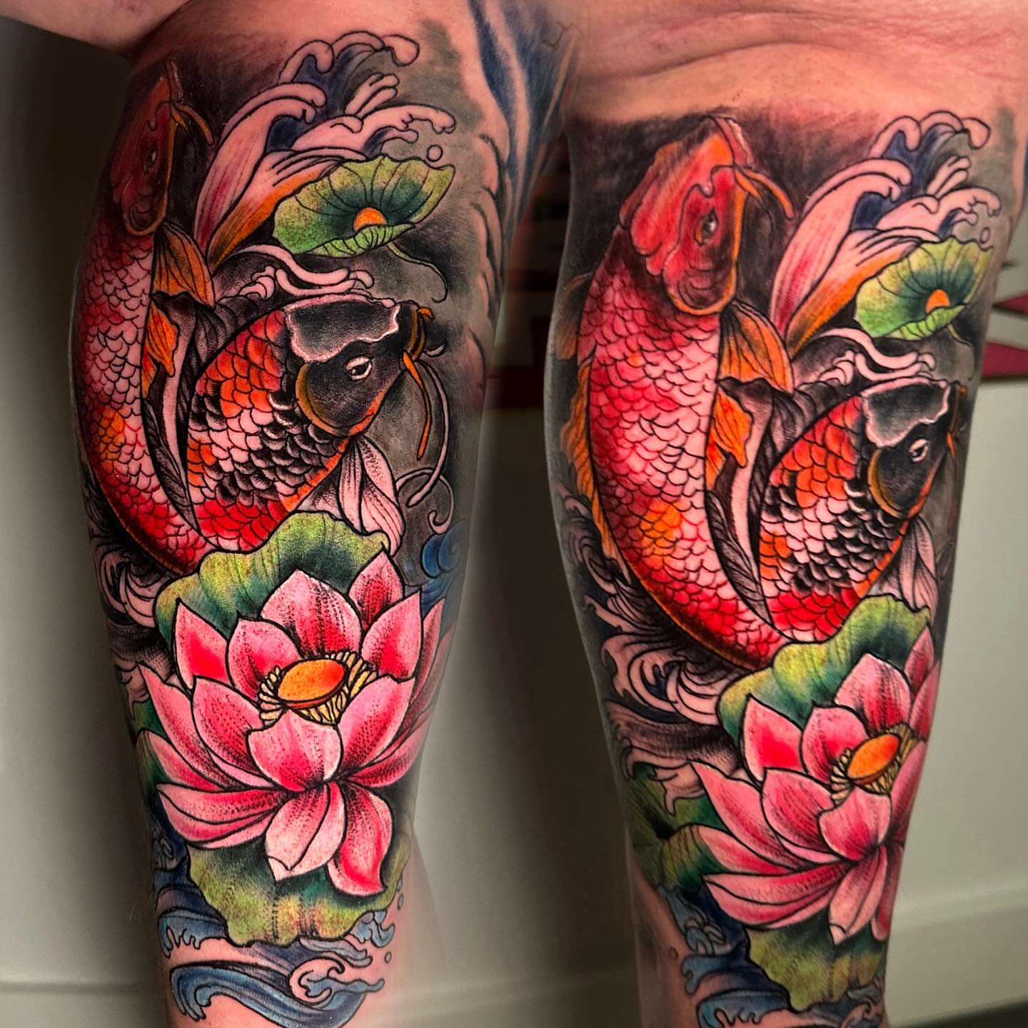 Koi fish and lotus flowers American traditional tattoo on the calf by Anghel Patricia