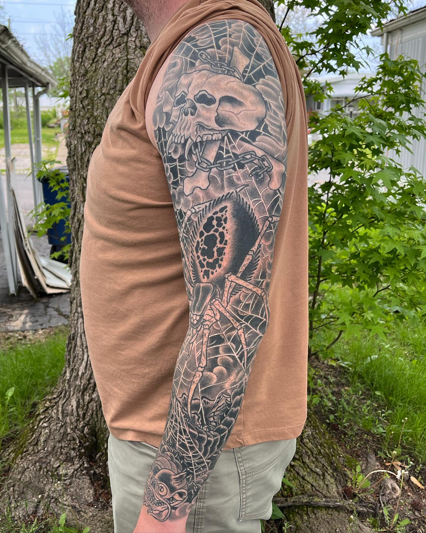 Skull and spider realism tattoo on the forearm by TYP 419, Toledo, Ohio