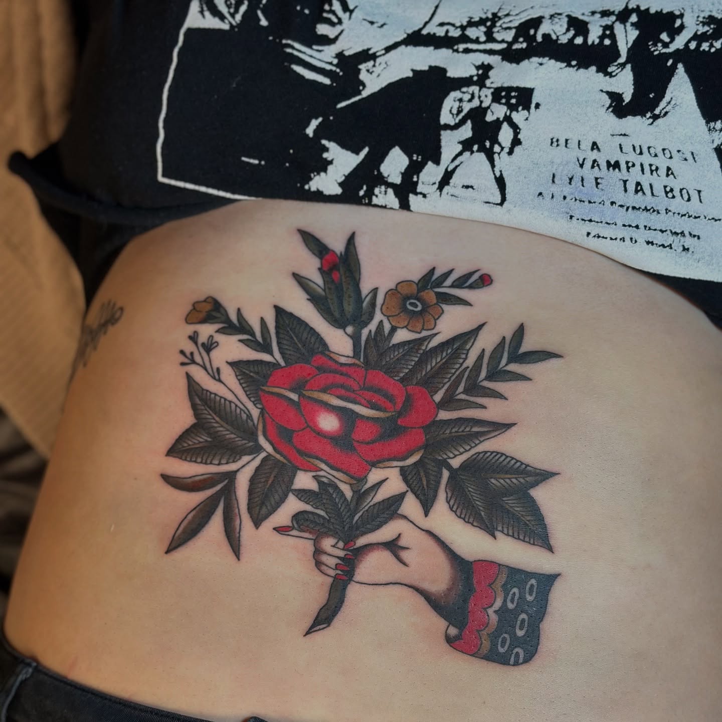 Red rose bouquet American traditional tattoo on the ribs by @ryleecoyote, New York, New York