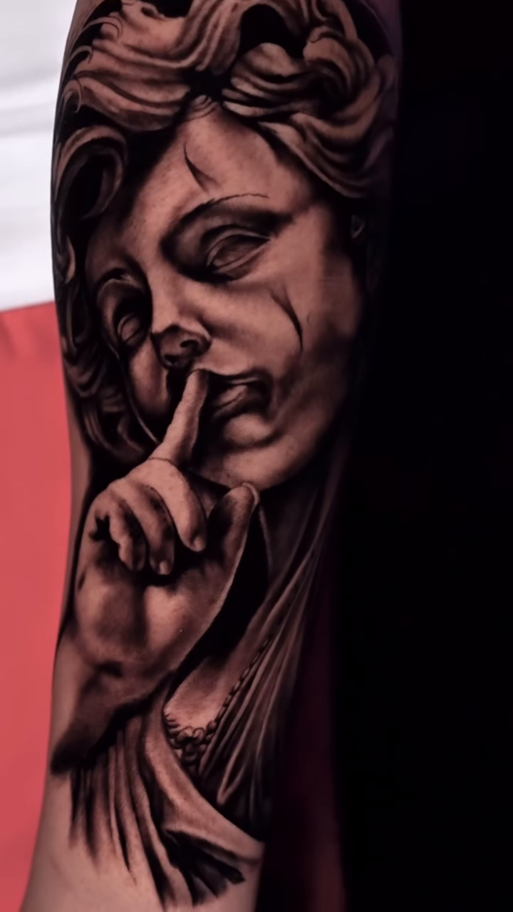 Woman with finger to lips realism tattoo by Kiefer Fonseca