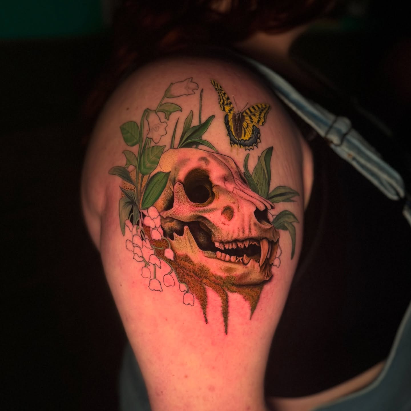 Skull with flowers and butterfly realism tattoo on the shoulder by Tay 🥀