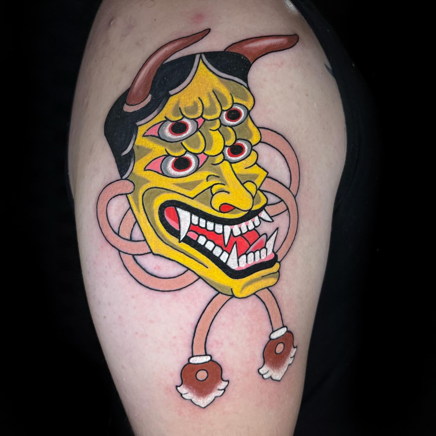 Demon mask American traditional tattoo on the thigh by Hayden Combs