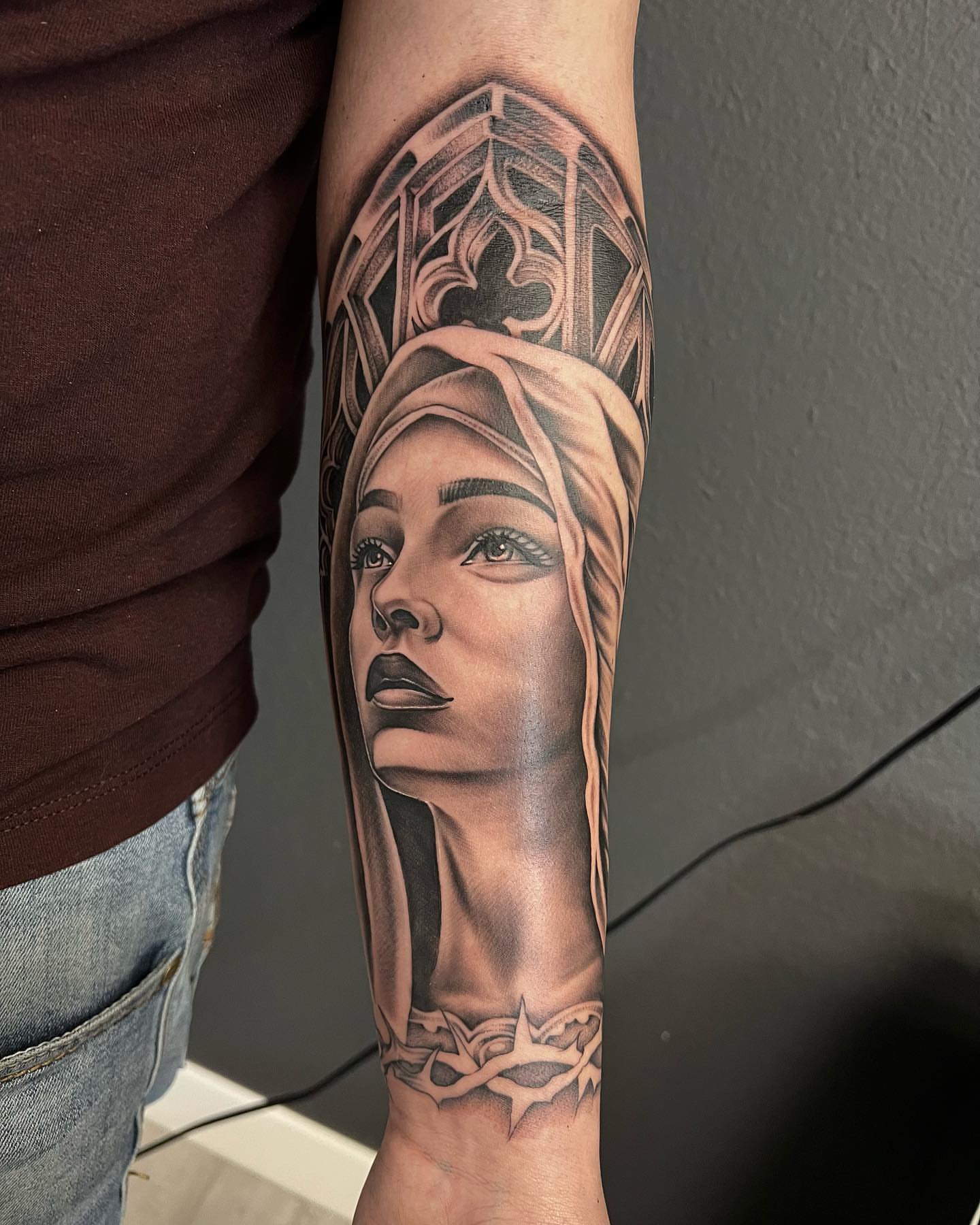 Woman's head realism tattoo on the forearm by Hugo Ruiz-Esparza