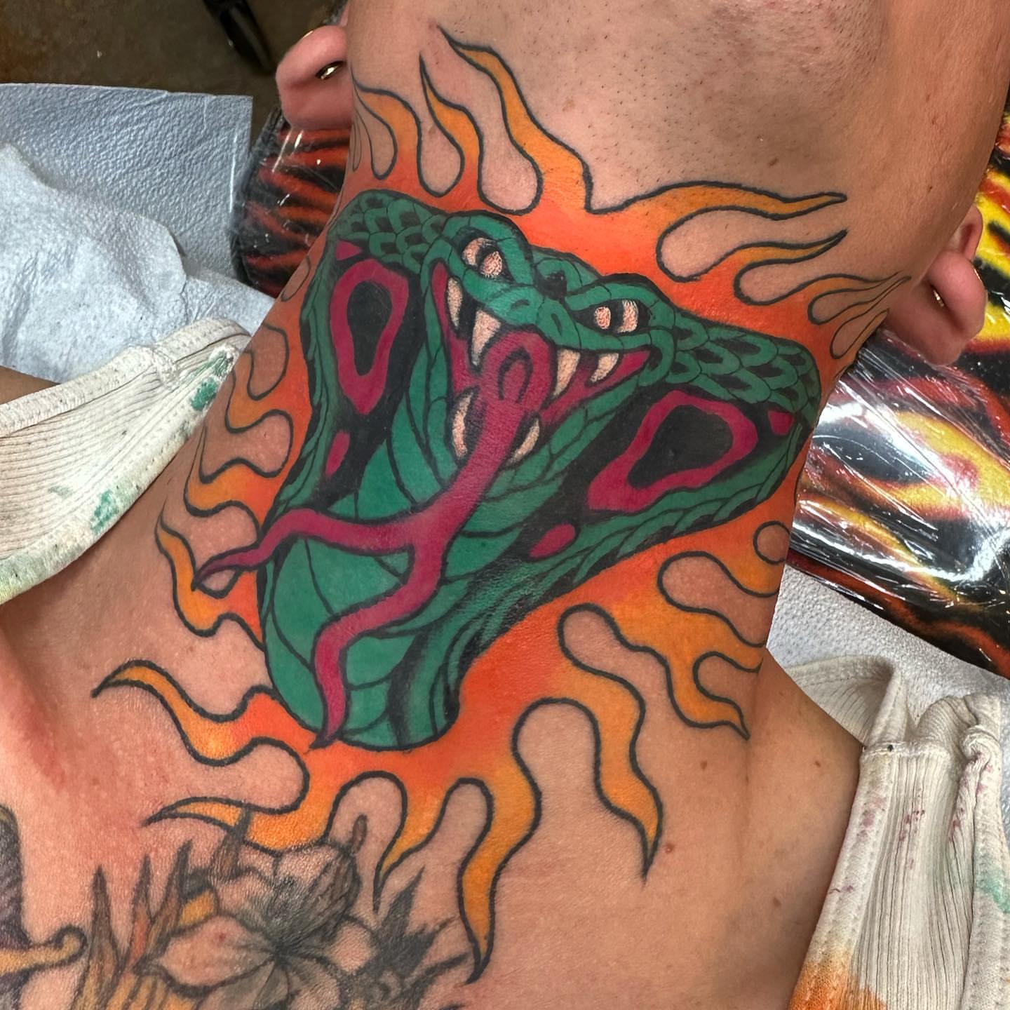 Snake new school tattoo on the upper arm by Alexa Wolfkiel