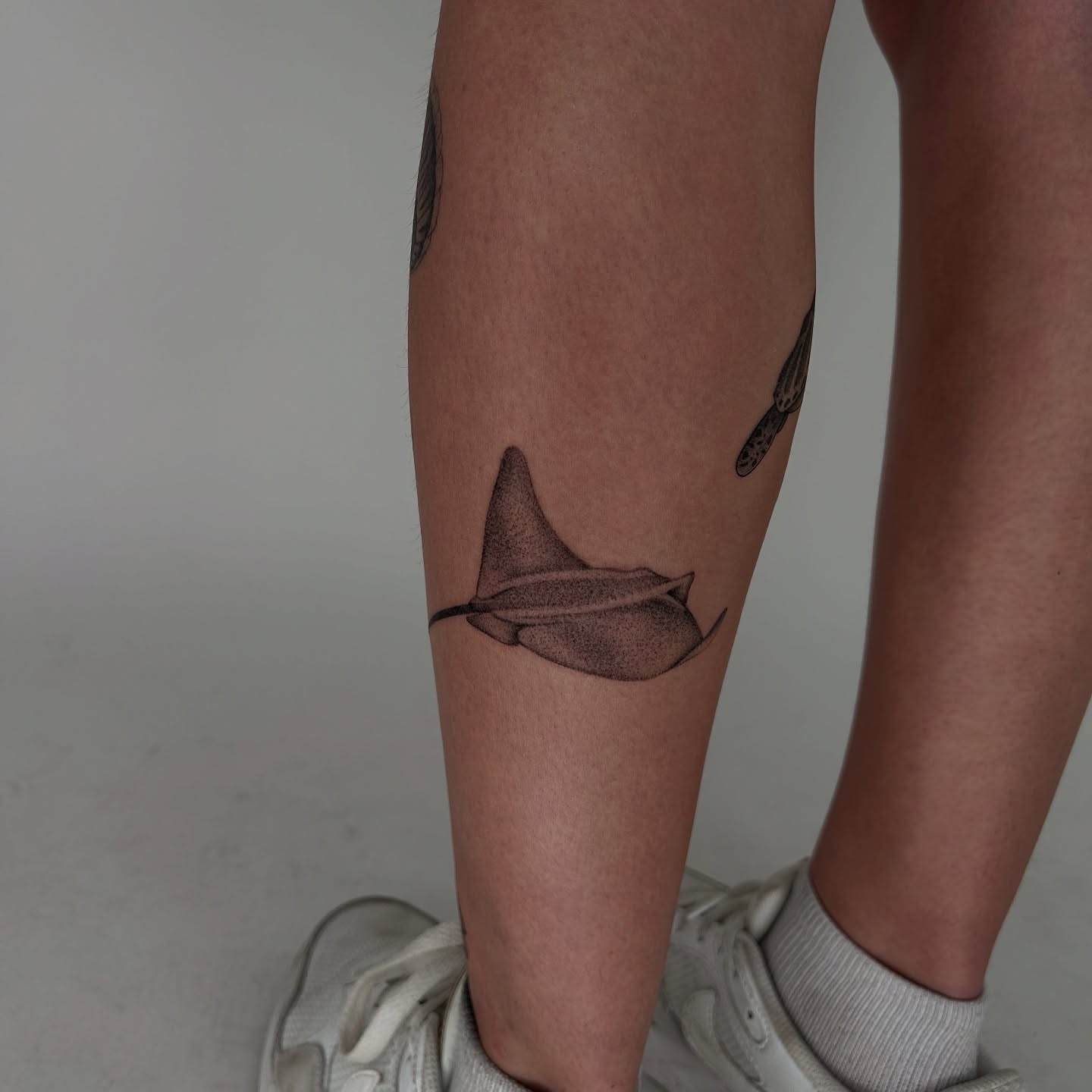 Ray dotwork tattoo on the calf by Kennedy Ramey