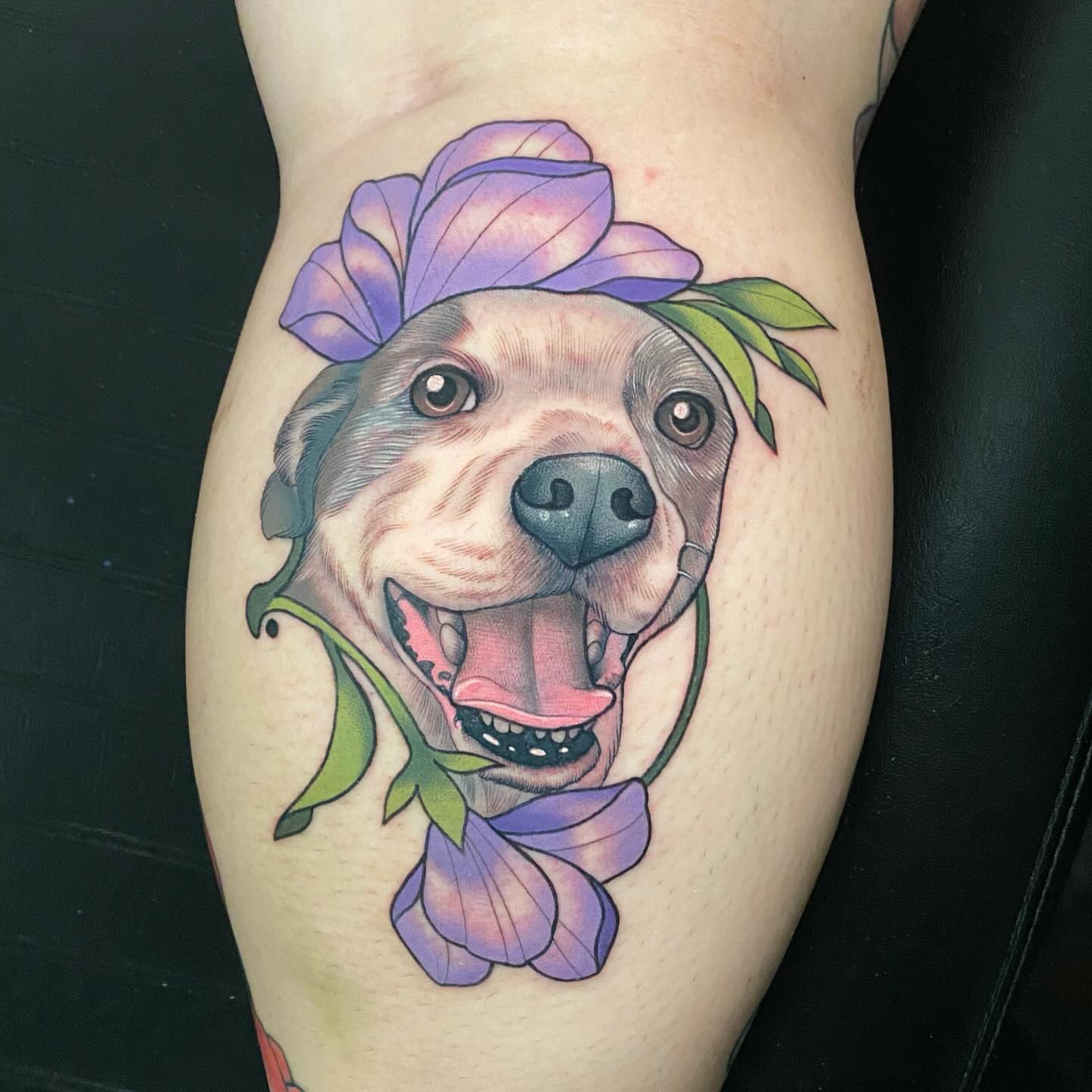 Pitbull with flowers realism tattoo on the thigh by Connie Fiorino - Tattoo Artist