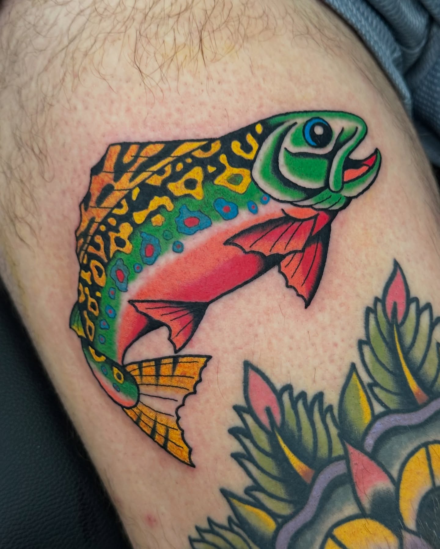 Rainbow trout American traditional tattoo on the thigh by Emily Masa