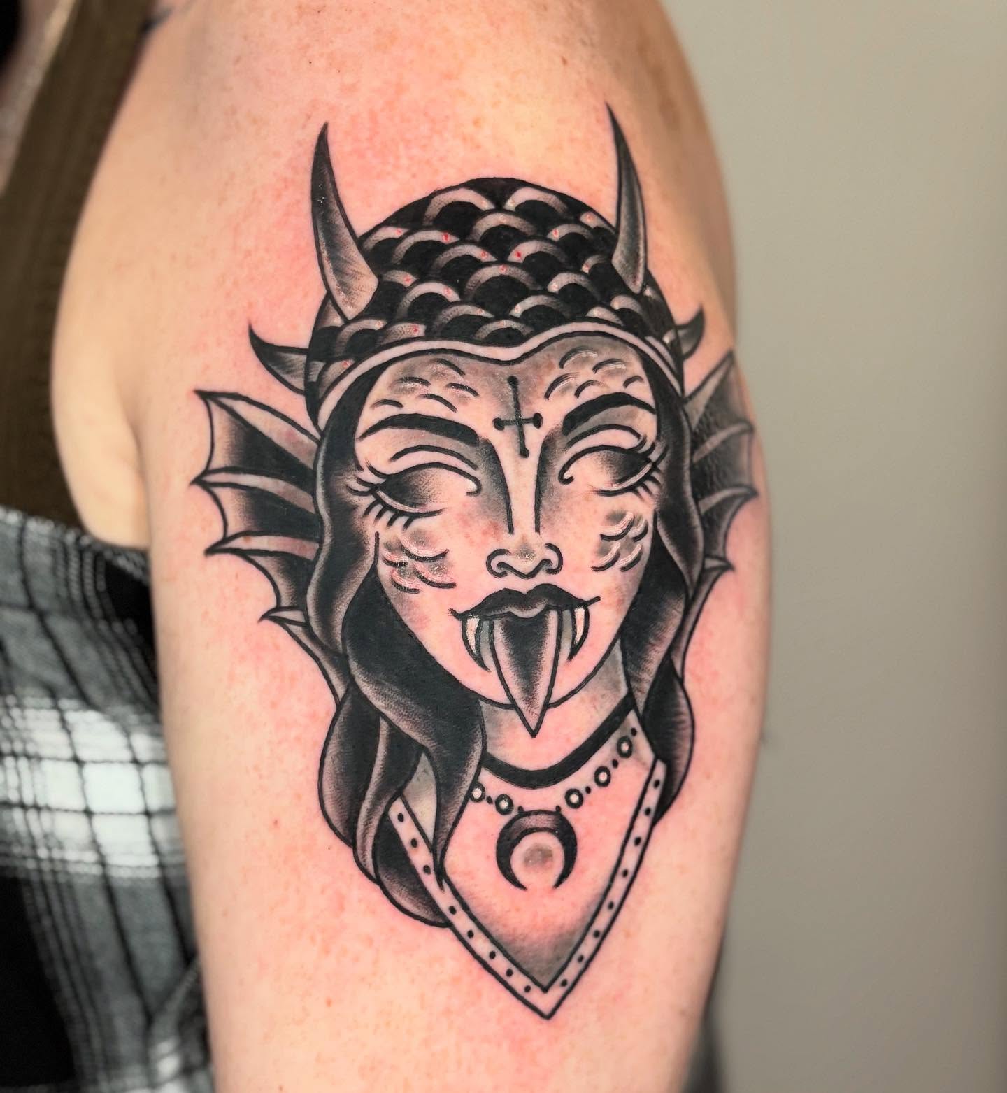 Demon woman black and grey tattoo on the upper arm by ๐ต๐๐๐๐ ๐ฎ๐๐๐๐๐๐, New Orleans, Louisiana