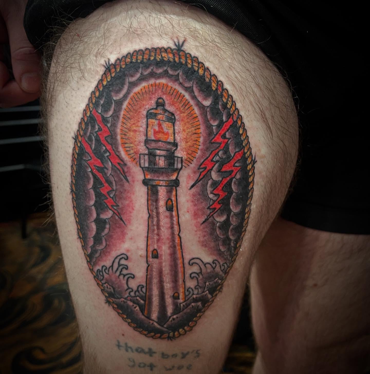 Lighthouse American traditional tattoo on the thigh by Don Juan