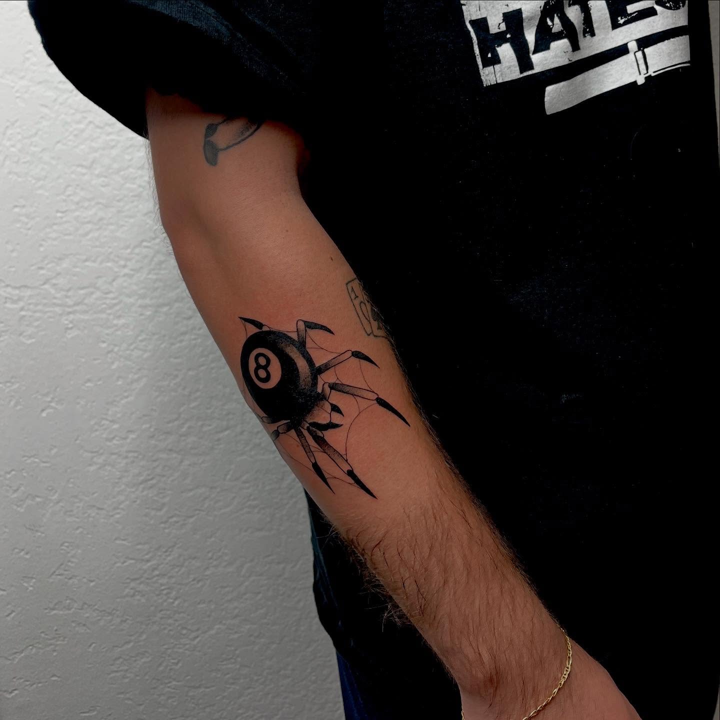 8-ball spider black and grey tattoo on the forearm by Las Vegas Tattoo Artist