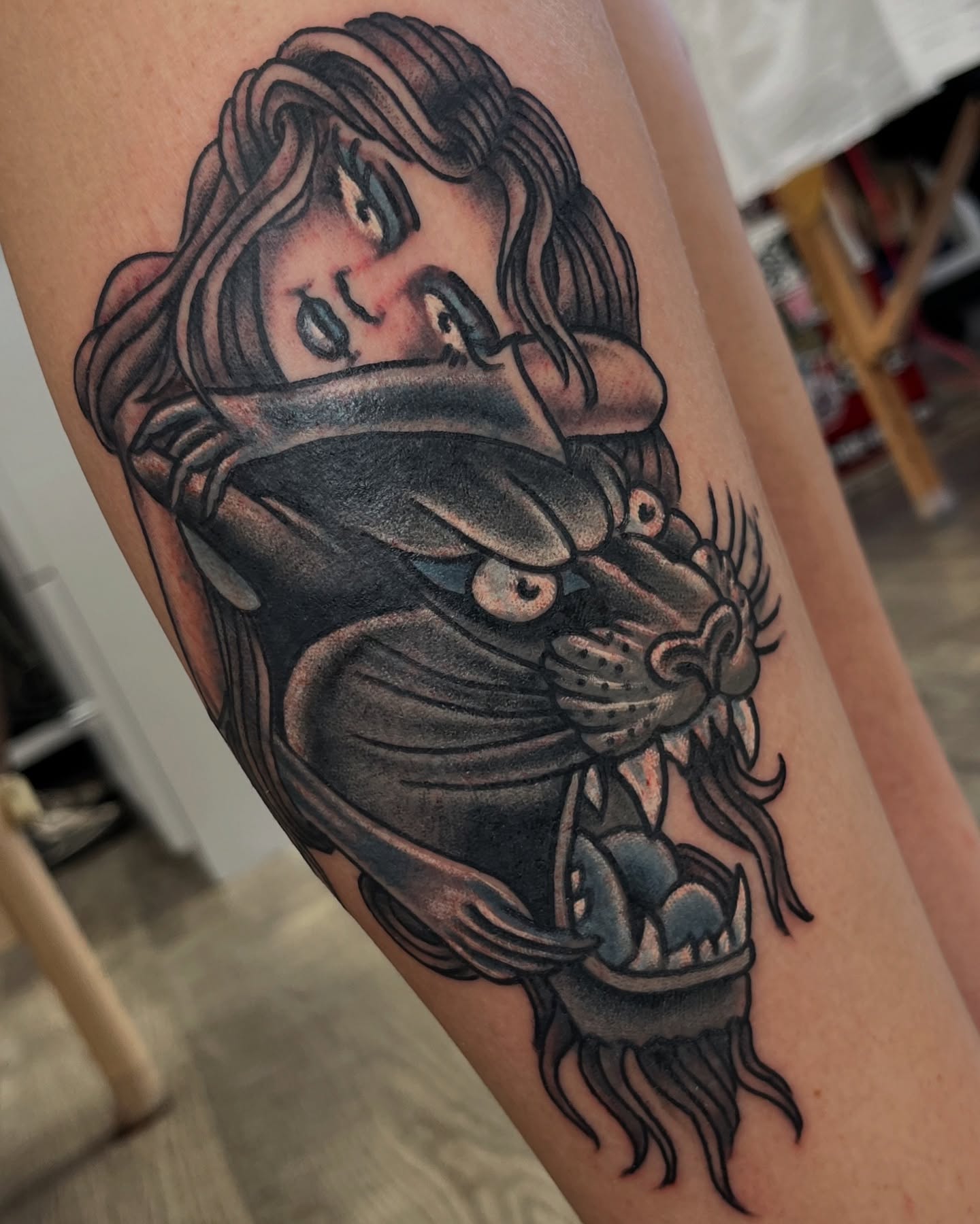 Woman being choked American traditional tattoo on the thigh by Steve Tiberi