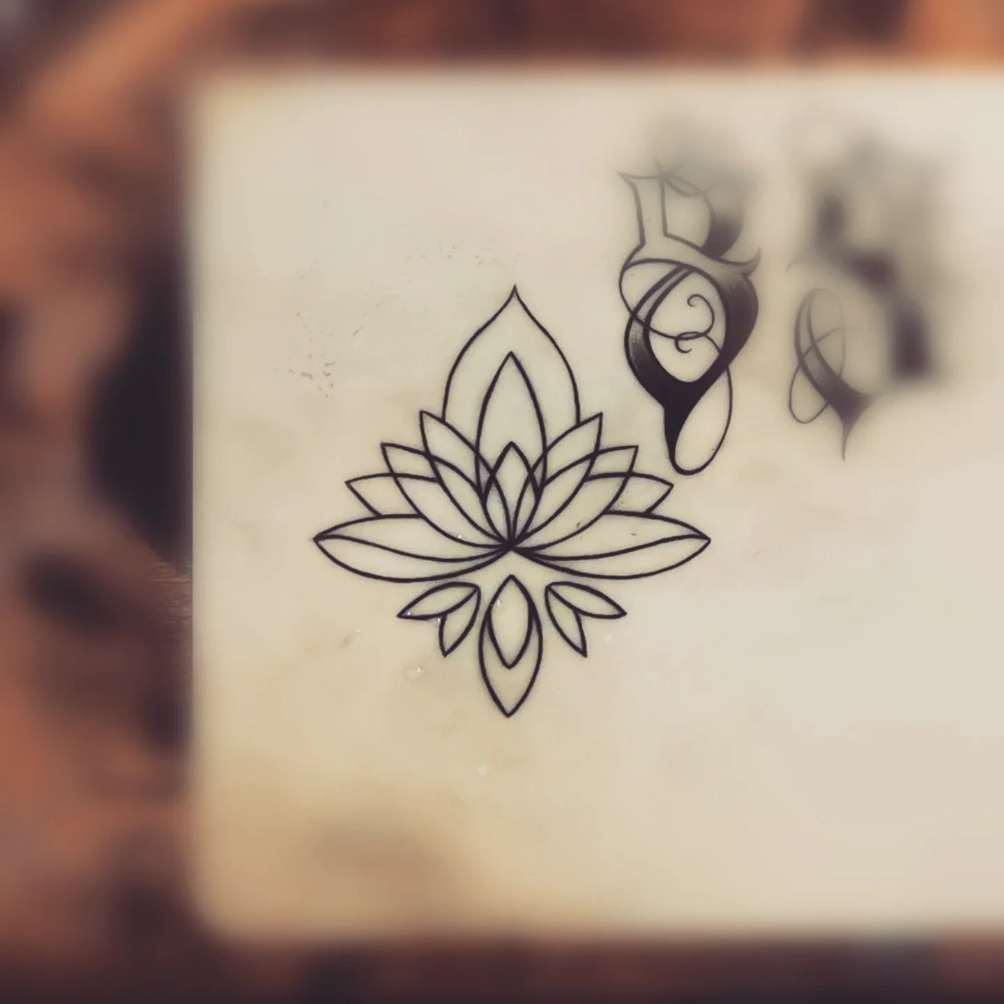 Lotus flower geometric tattoo by Ink of Winchester